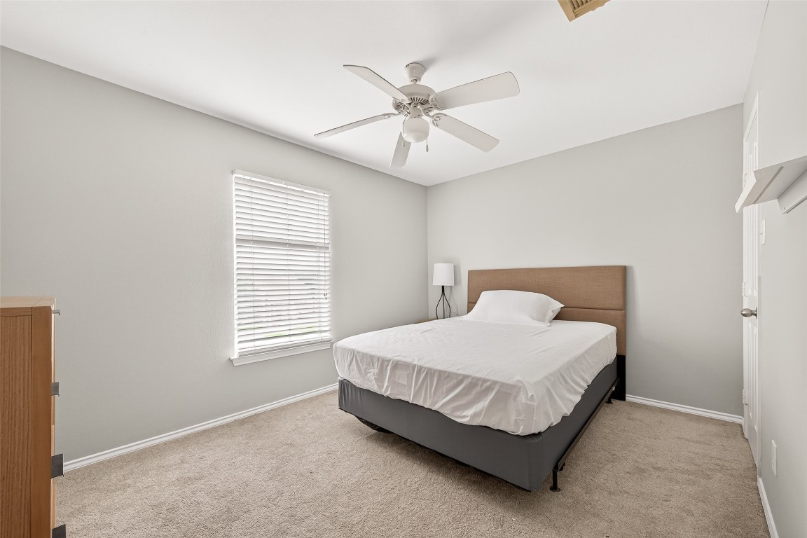 25507 Lyon Springs Court Spring, TX 77373 - Photo 32 of 39 a bedroom with a bed and window