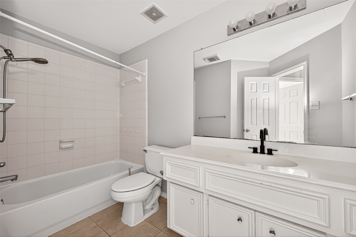 25507 Lyon Springs Court Spring, TX 77373 - Photo 34 of 39 a bathroom with a sink a toilet and a bathtub