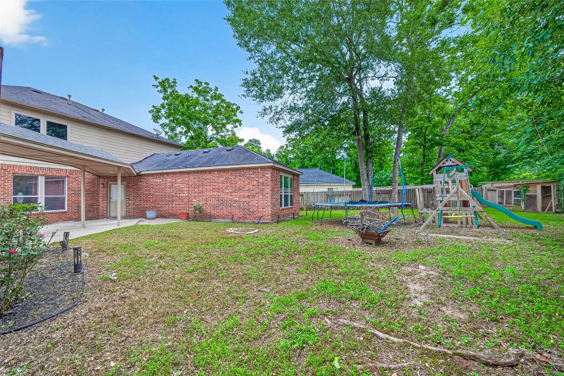 25507 Lyon Springs Court Spring, TX 77373 - Photo 37 of 39 a view of a backyard with a tree