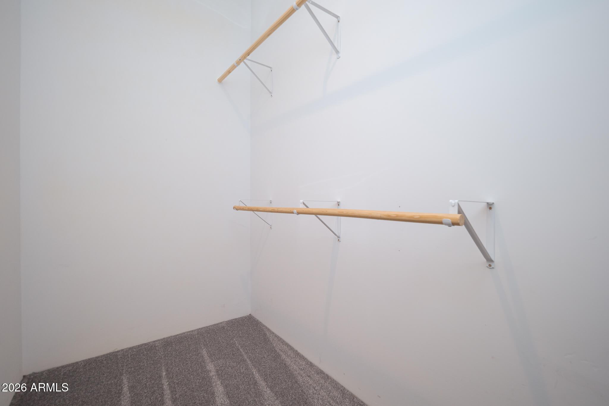 12945 West Varney Road El Mirage, AZ 85335 - Photo 33 of 70 PRIMARY BEDROOM WALK-IN CLOSET