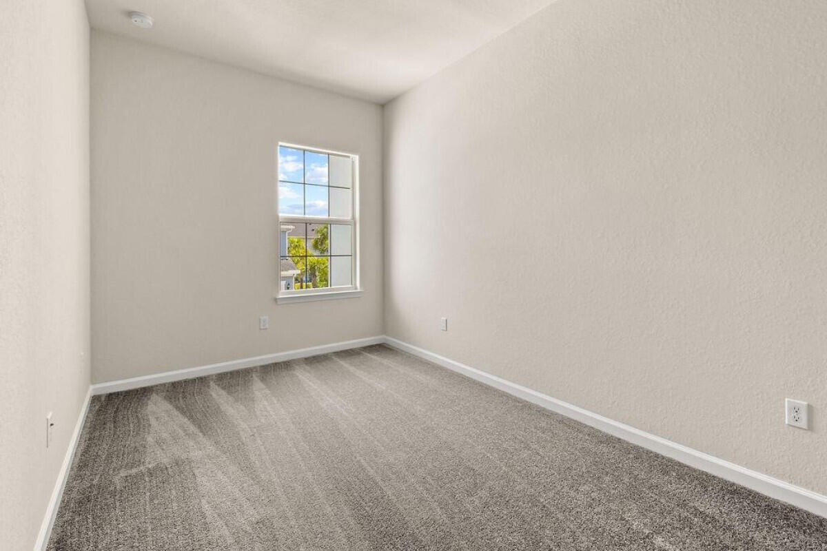1805 Southeast Ocean Cove Way Stuart, FL 34996 - Photo 13 of 23 an empty room with windows