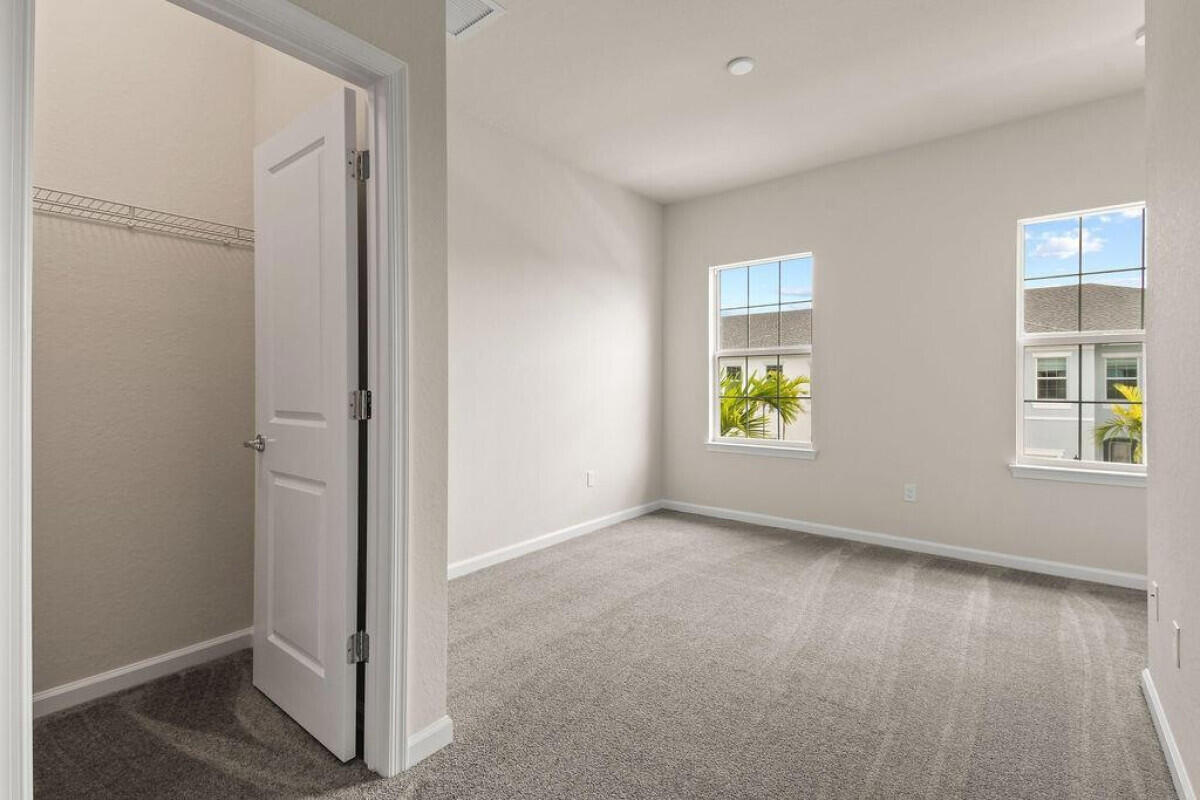 1805 Southeast Ocean Cove Way Stuart, FL 34996 - Photo 16 of 23 an empty room with windows