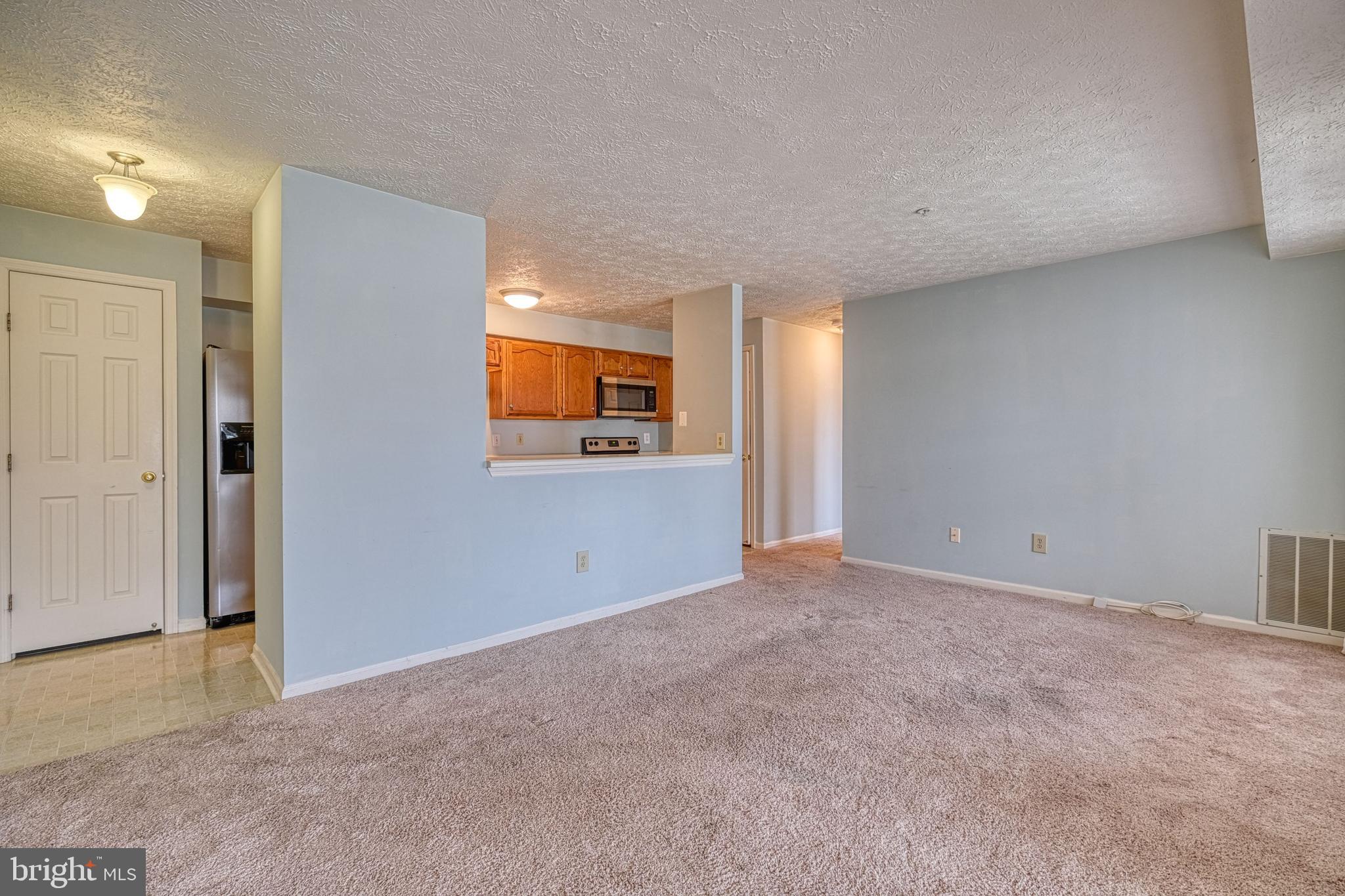 863 Deering Road, Unit 9H Pasadena, MD 21122 - Photo 3 of 26 Family room open to kitchen