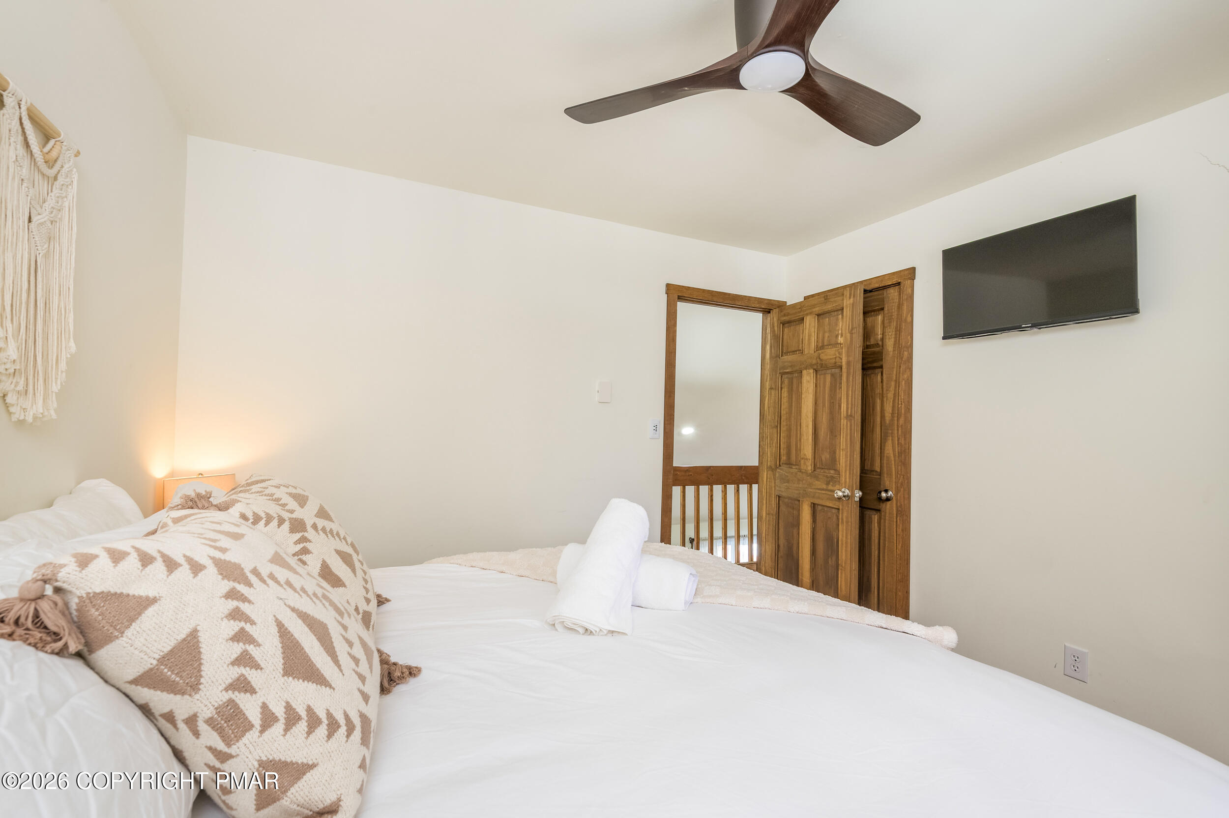 2206 Chatham Drive Bushkill, PA 18324 - Photo 12 of 45 a bedroom with a large bed and a tv