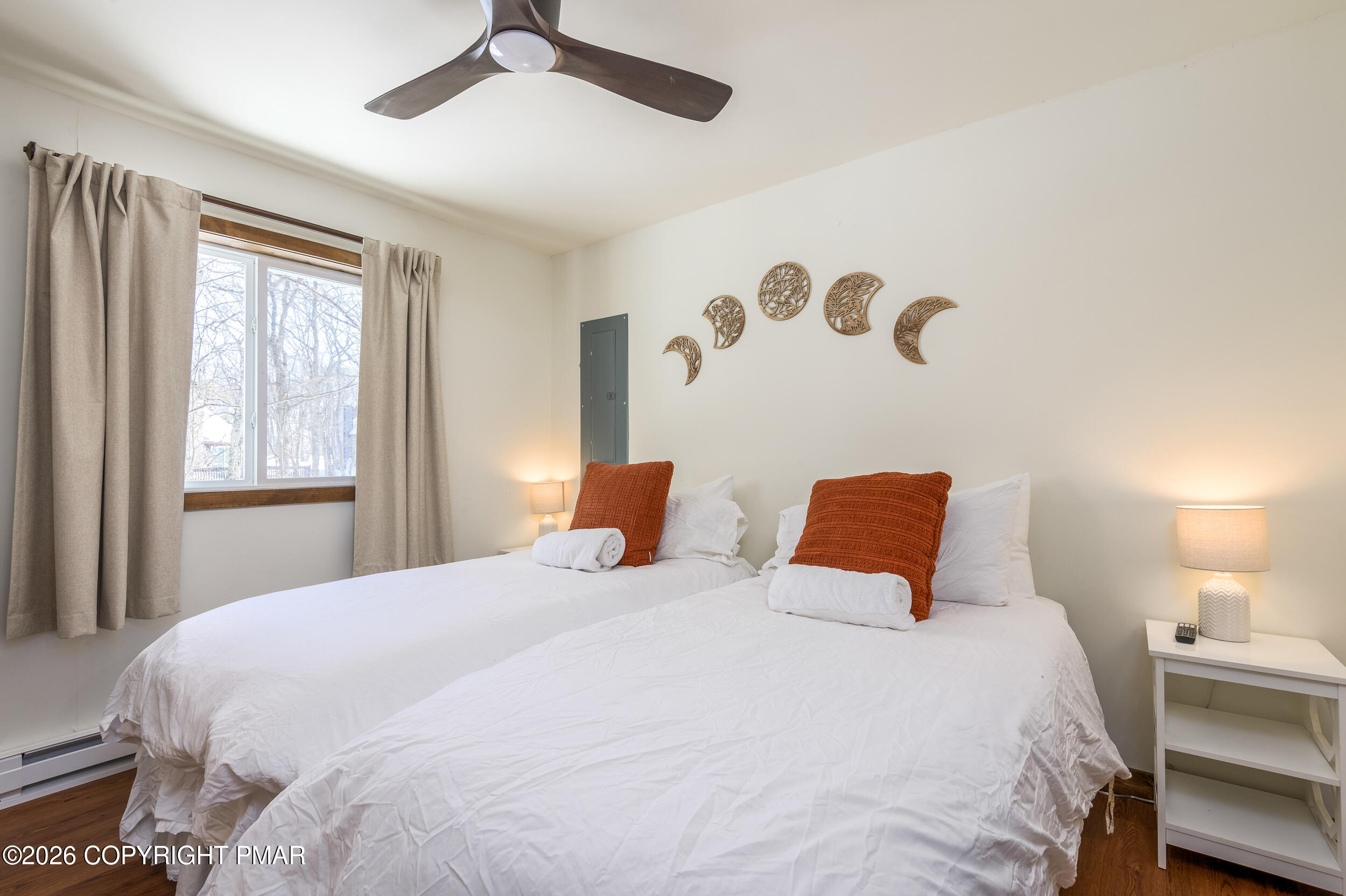 2206 Chatham Drive Bushkill, PA 18324 - Photo 15 of 45 a bedroom with a bed and a chandelier