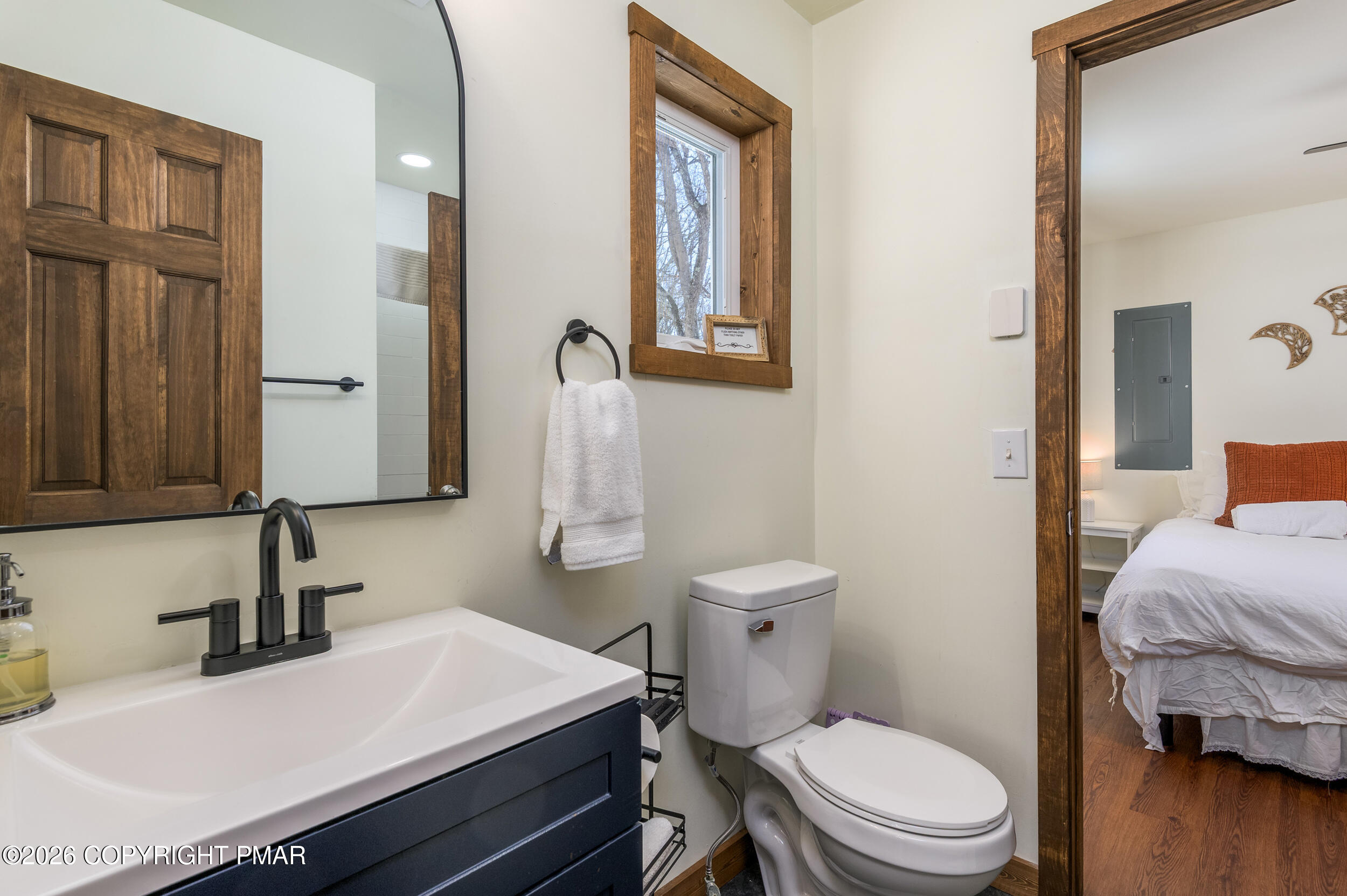 2206 Chatham Drive Bushkill, PA 18324 - Photo 17 of 45 a bathroom with a sink a toilet and a mirror