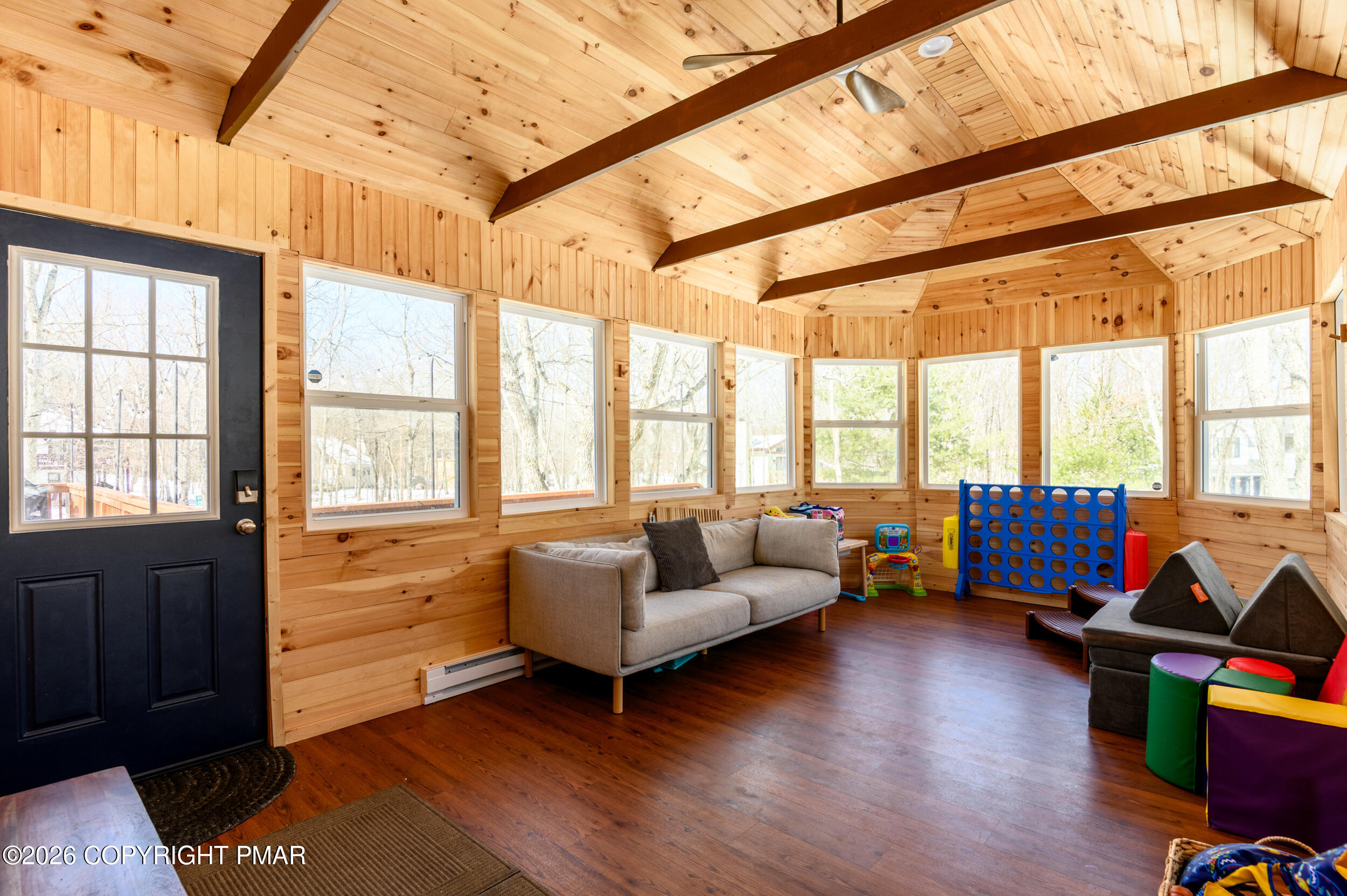 2206 Chatham Drive Bushkill, PA 18324 - Photo 21 of 45 a living room with furniture and a large window