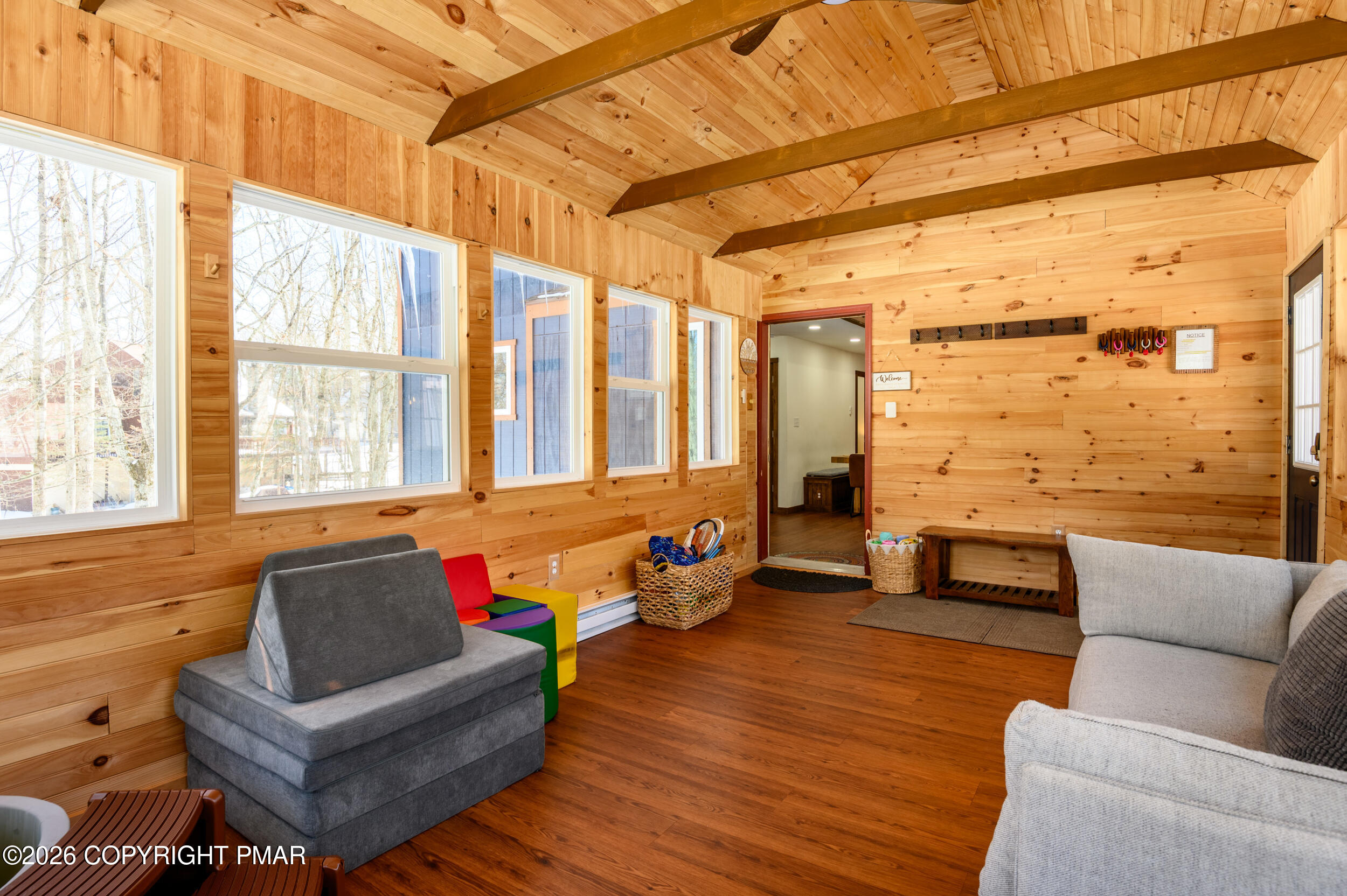 2206 Chatham Drive Bushkill, PA 18324 - Photo 22 of 45 a living room with furniture and a large window
