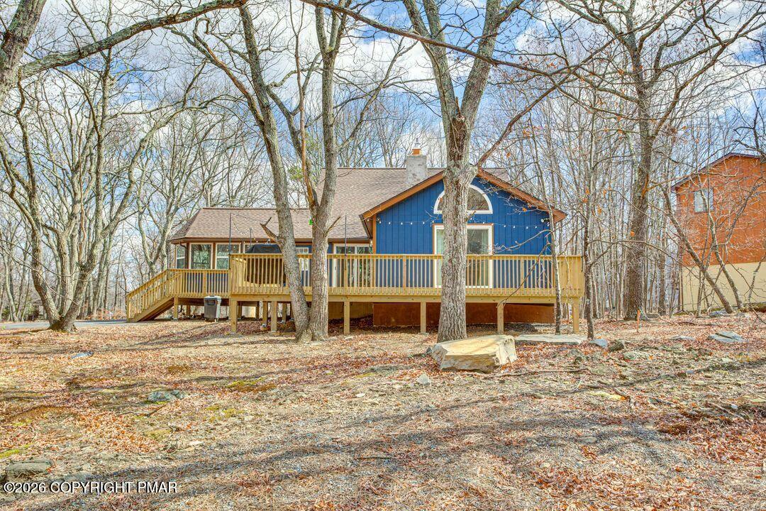 2206 Chatham Drive Bushkill, PA 18324 - Photo 27 of 45 a front view of a house with a yard covered with snow