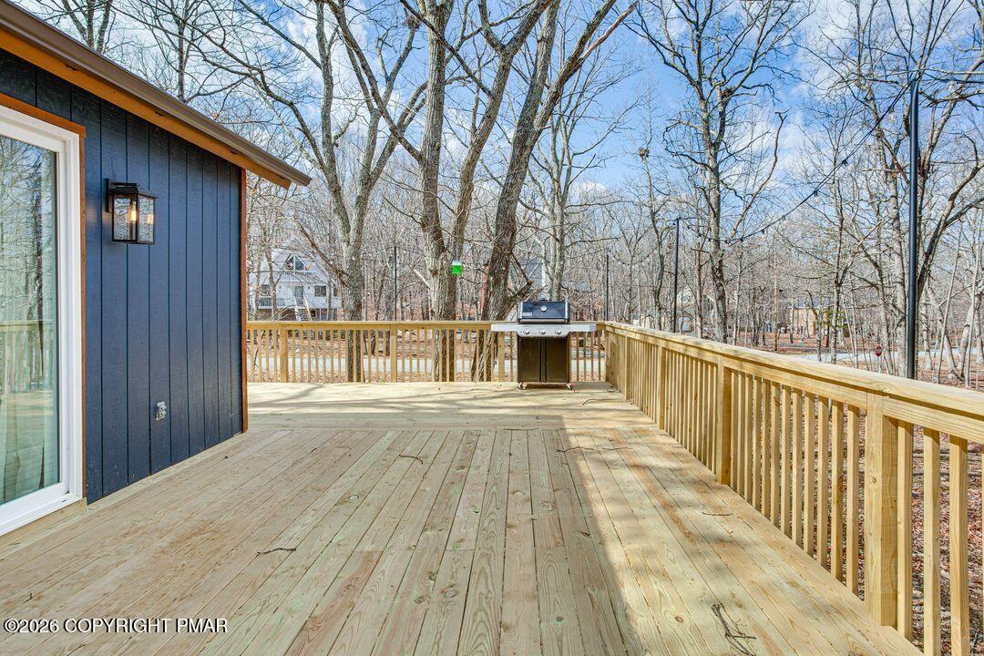 2206 Chatham Drive Bushkill, PA 18324 - Photo 30 of 45 a view of balcony with wooden floor and fence