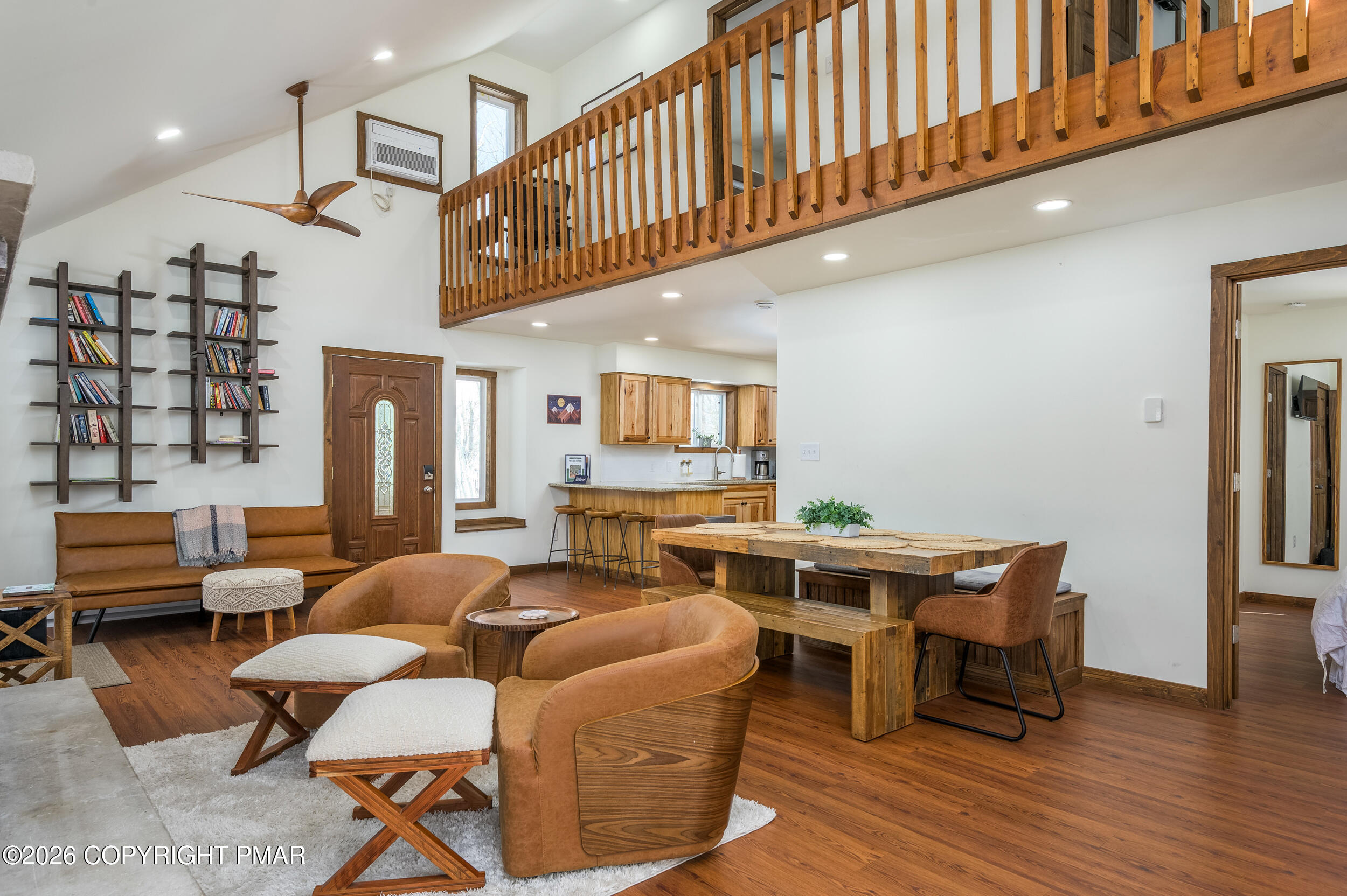 2206 Chatham Drive Bushkill, PA 18324 - Photo 3 of 45 a living room with furniture a flat screen tv and kitchen floor