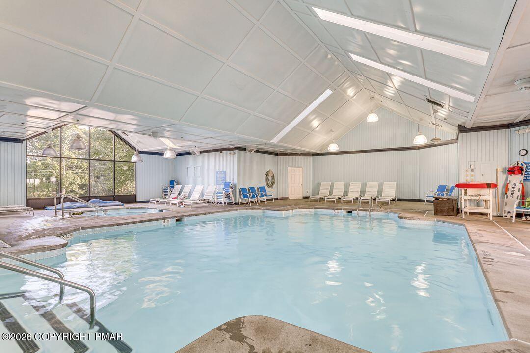 2206 Chatham Drive Bushkill, PA 18324 - Photo 40 of 45 a view of a kitchen with kitchen island a sink stainless steel appliances cabinets and a dining table