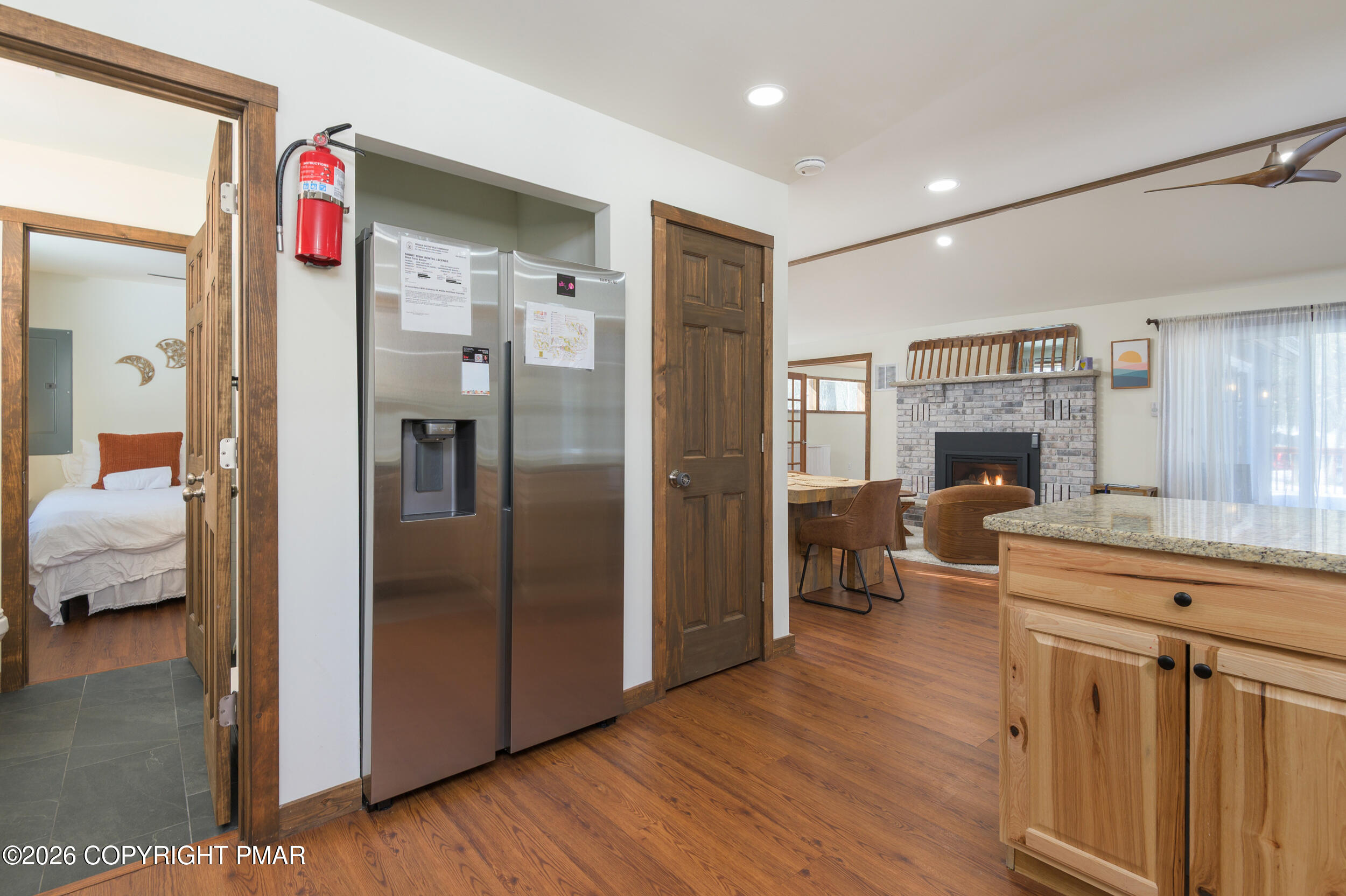 2206 Chatham Drive Bushkill, PA 18324 - Photo 7 of 45 a kitchen with kitchen island wooden floor center island and stainless steel appliances
