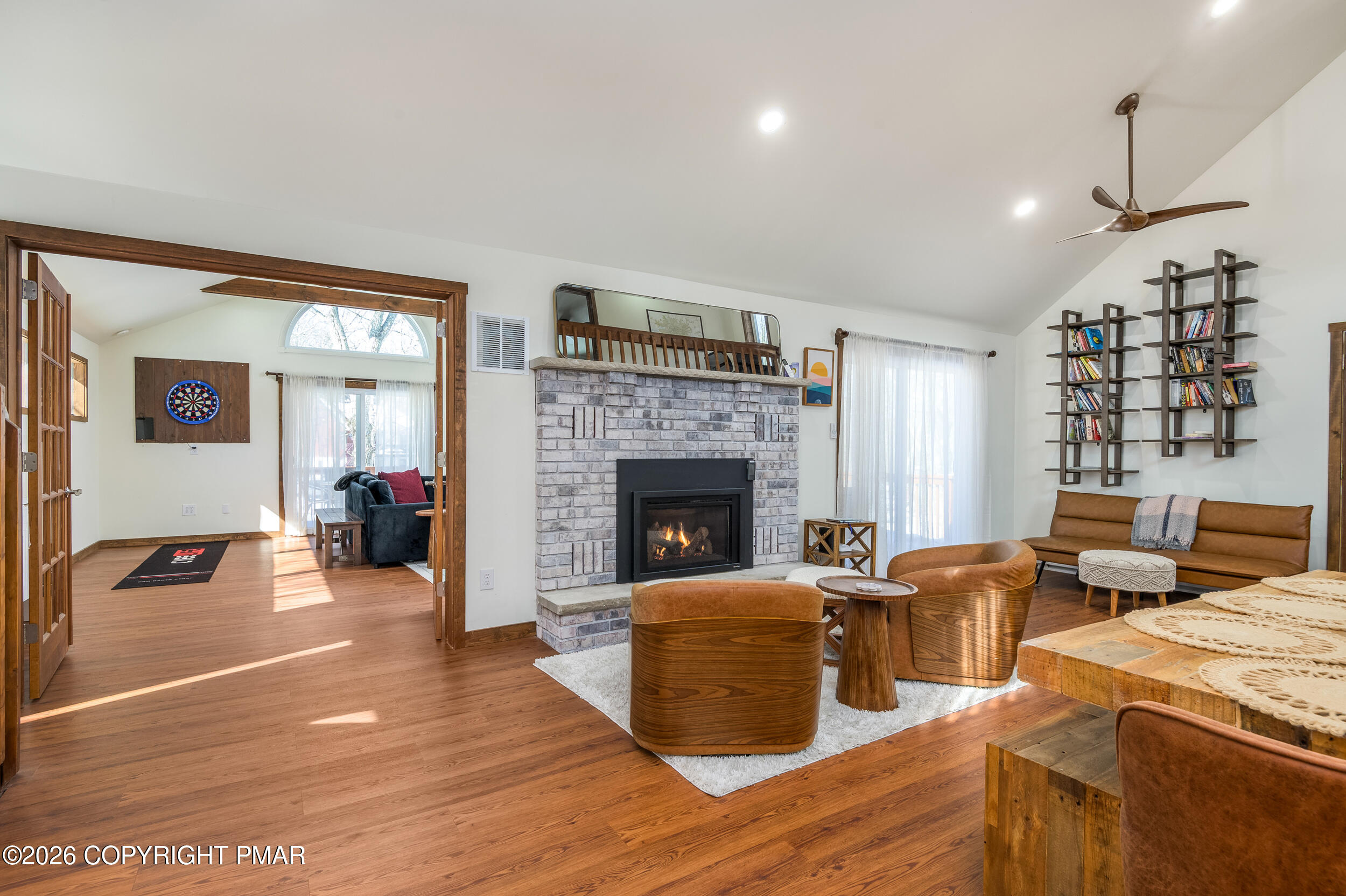 2206 Chatham Drive Bushkill, PA 18324 - Photo 8 of 45 a living room with furniture large window and a fireplace
