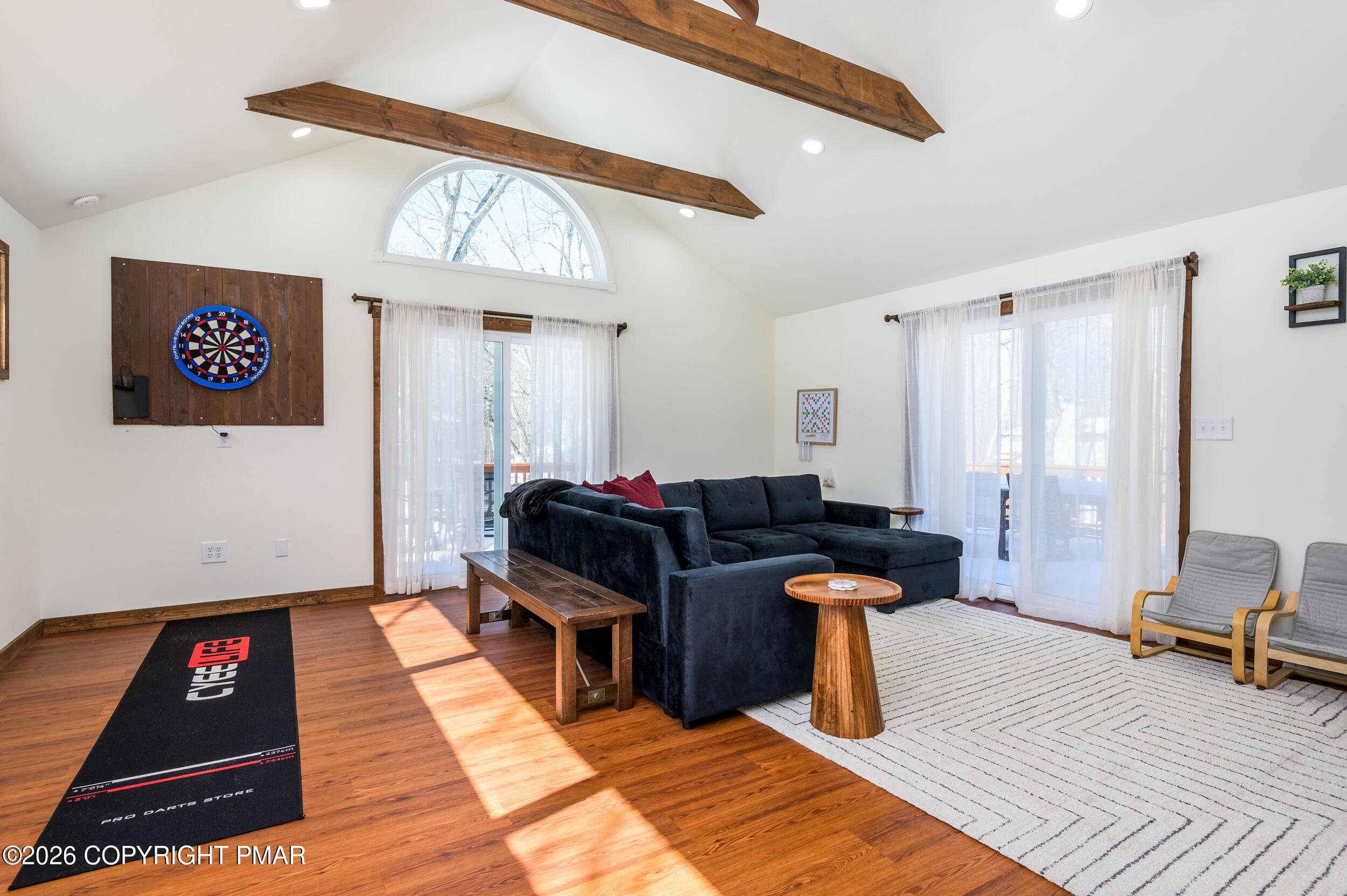 2206 Chatham Drive Bushkill, PA 18324 - Photo 9 of 45 a living room with furniture a rug and white walls