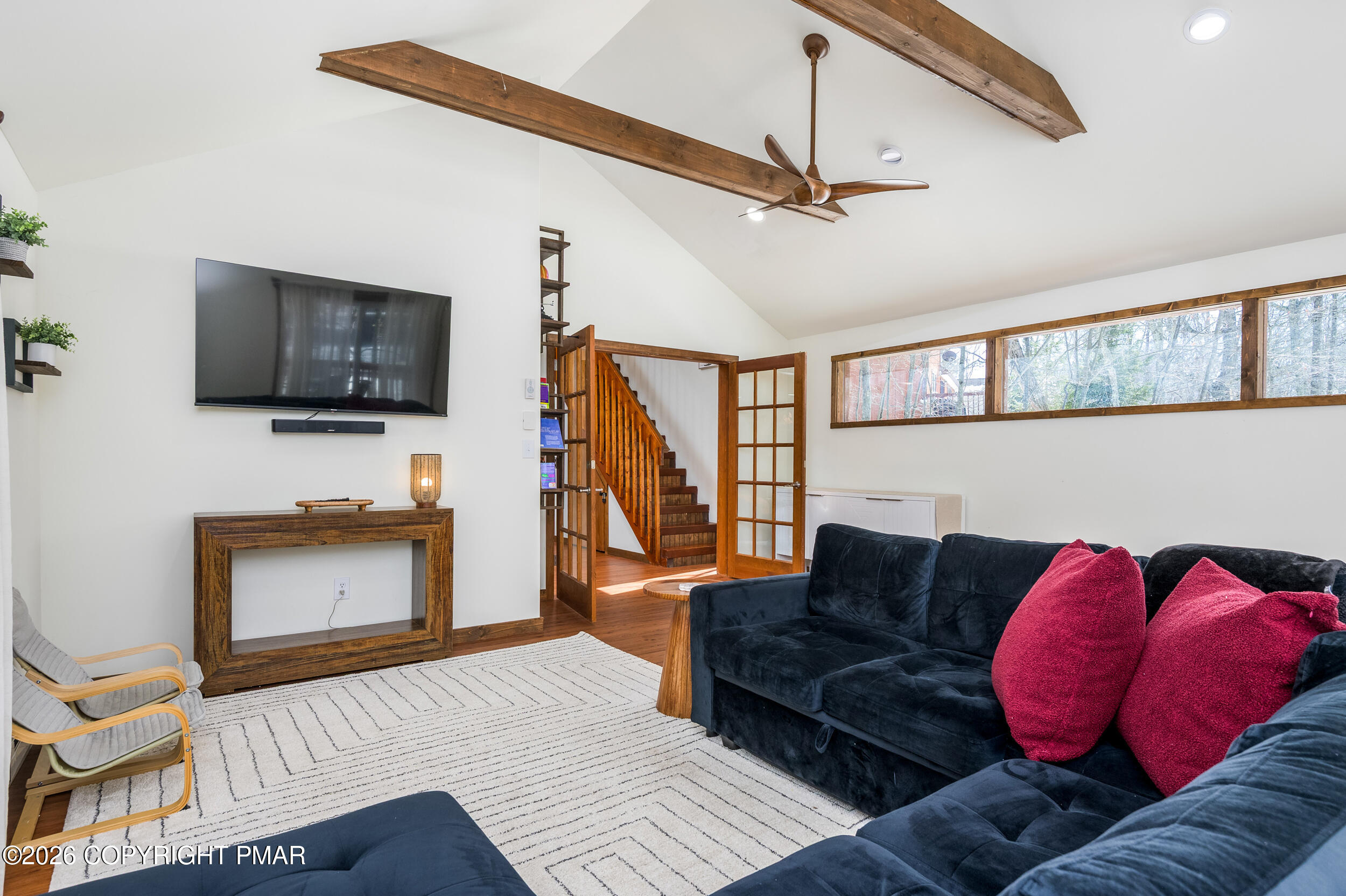 2206 Chatham Drive Bushkill, PA 18324 - Photo 10 of 45 a living room with furniture and a flat screen tv