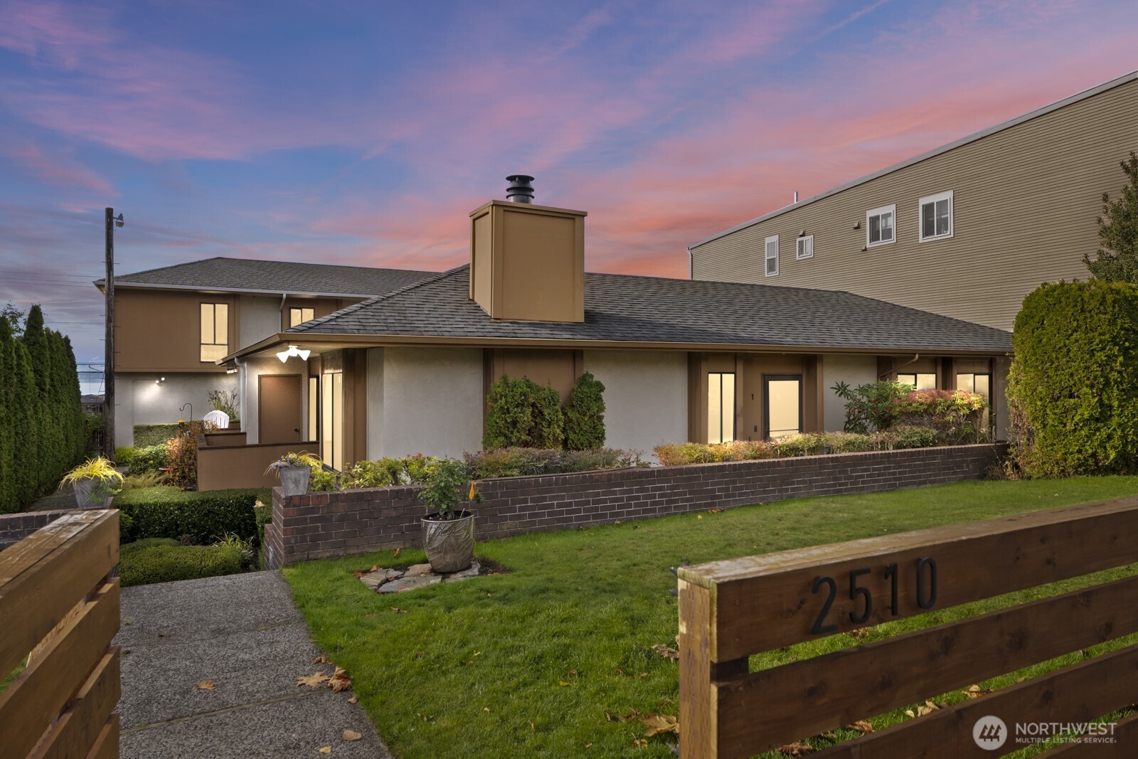 2510 Rucker Avenue, Unit 1 Everett, WA 98201 - Photo 1 of 34 a front view of a house with a yard