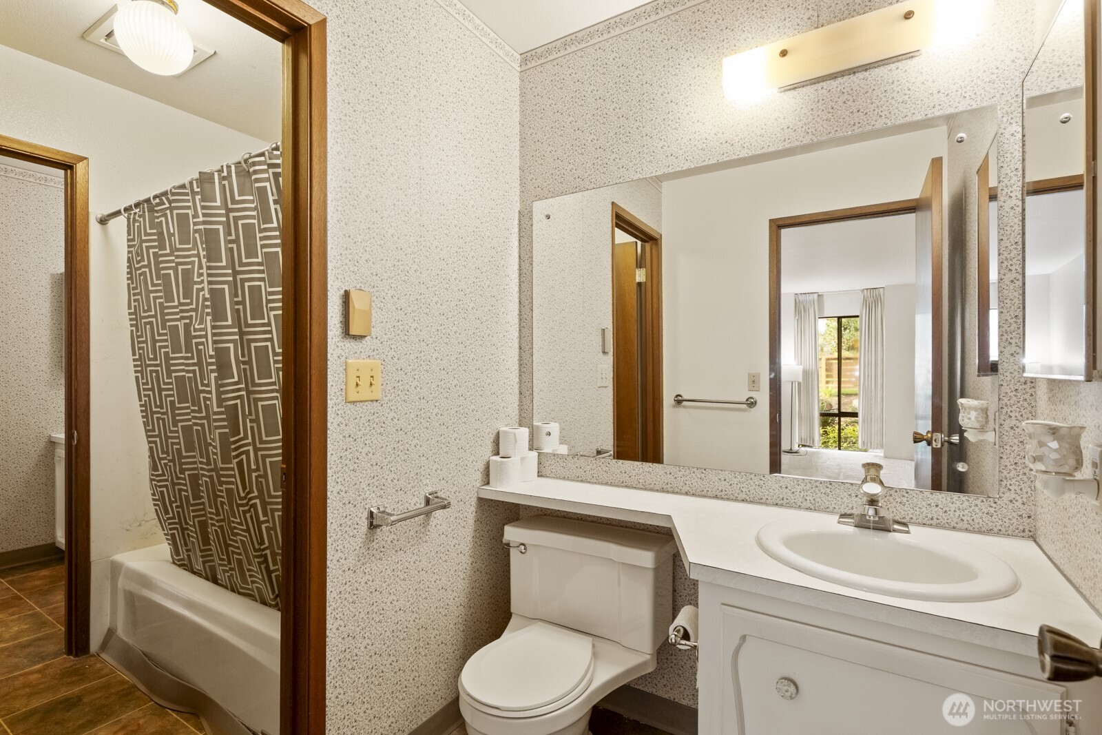 2510 Rucker Avenue, Unit 1 Everett, WA 98201 - Photo 12 of 34 a bathroom with a toilet a sink and mirror