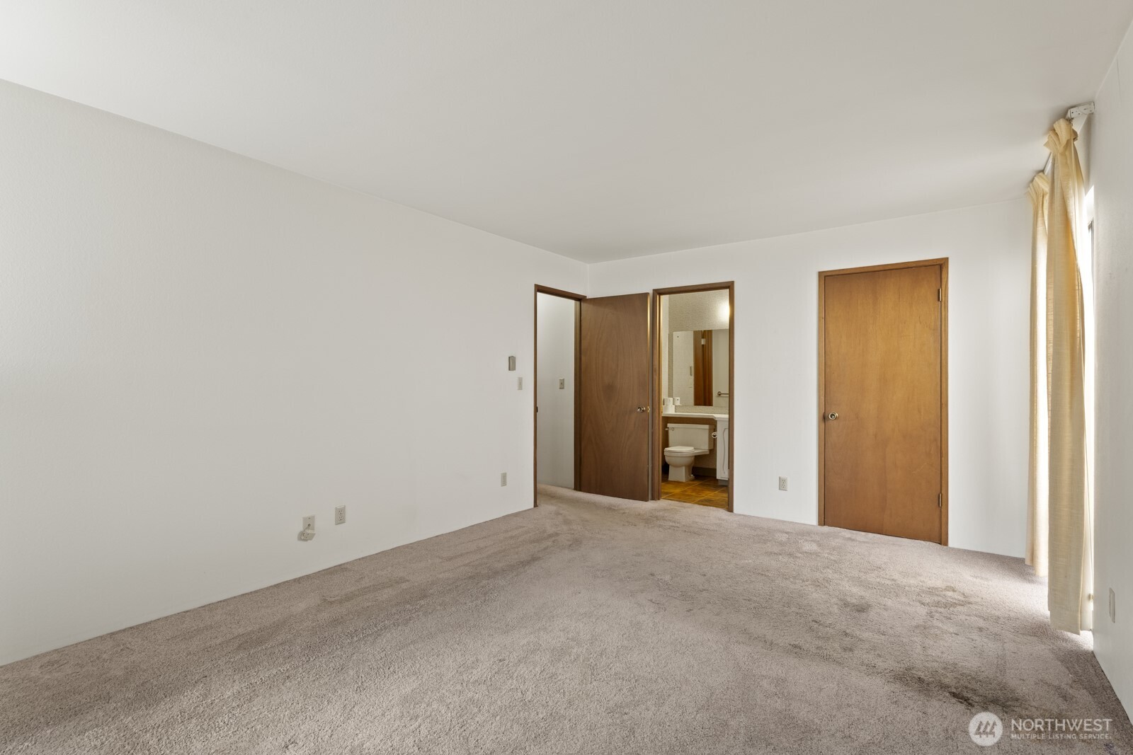 2510 Rucker Avenue, Unit 1 Everett, WA 98201 - Photo 13 of 34 a view of an empty room with closet and a window