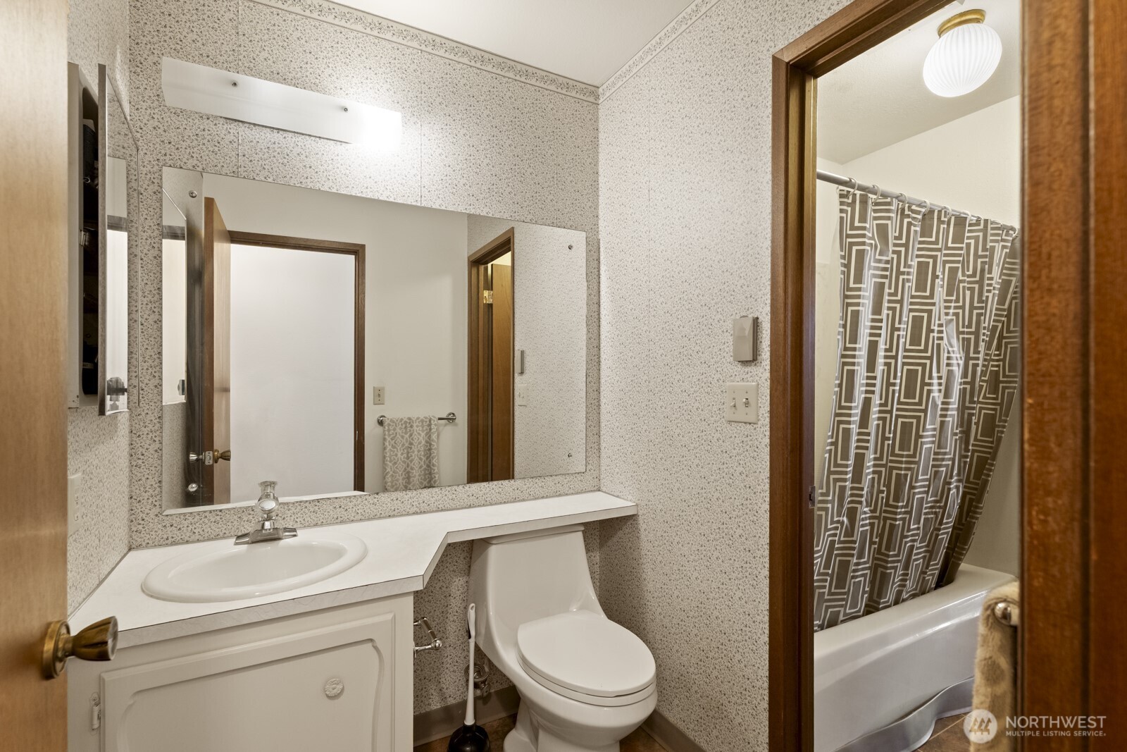 2510 Rucker Avenue, Unit 1 Everett, WA 98201 - Photo 15 of 34 a bathroom with a toilet a sink and mirror