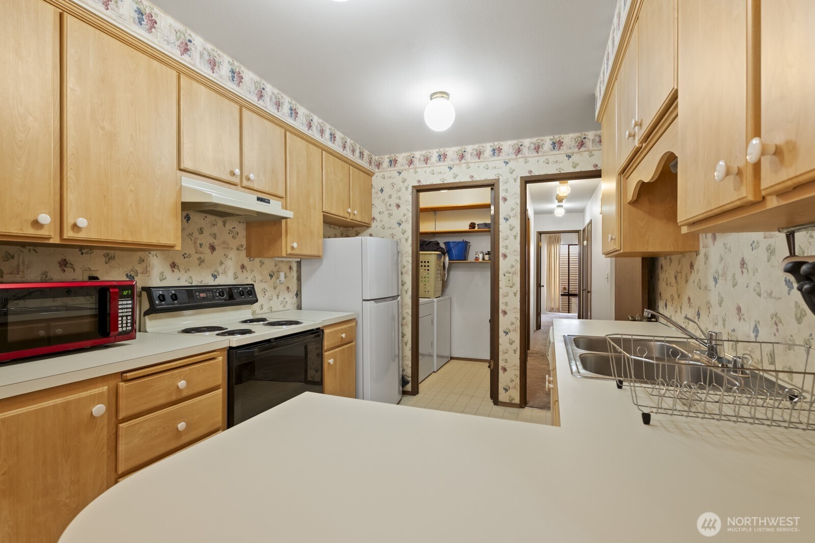 2510 Rucker Avenue, Unit 1 Everett, WA 98201 - Photo 18 of 34 a kitchen with stainless steel appliances granite countertop a stove a sink and a refrigerator