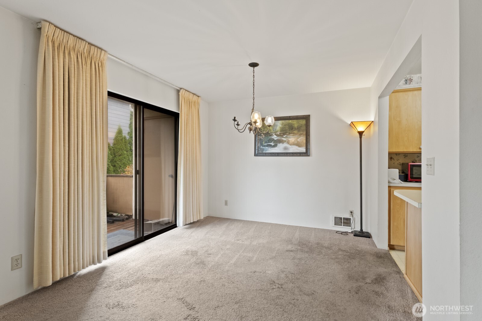 2510 Rucker Avenue, Unit 1 Everett, WA 98201 - Photo 20 of 34 a view of a hallway with wooden floor and chandelier