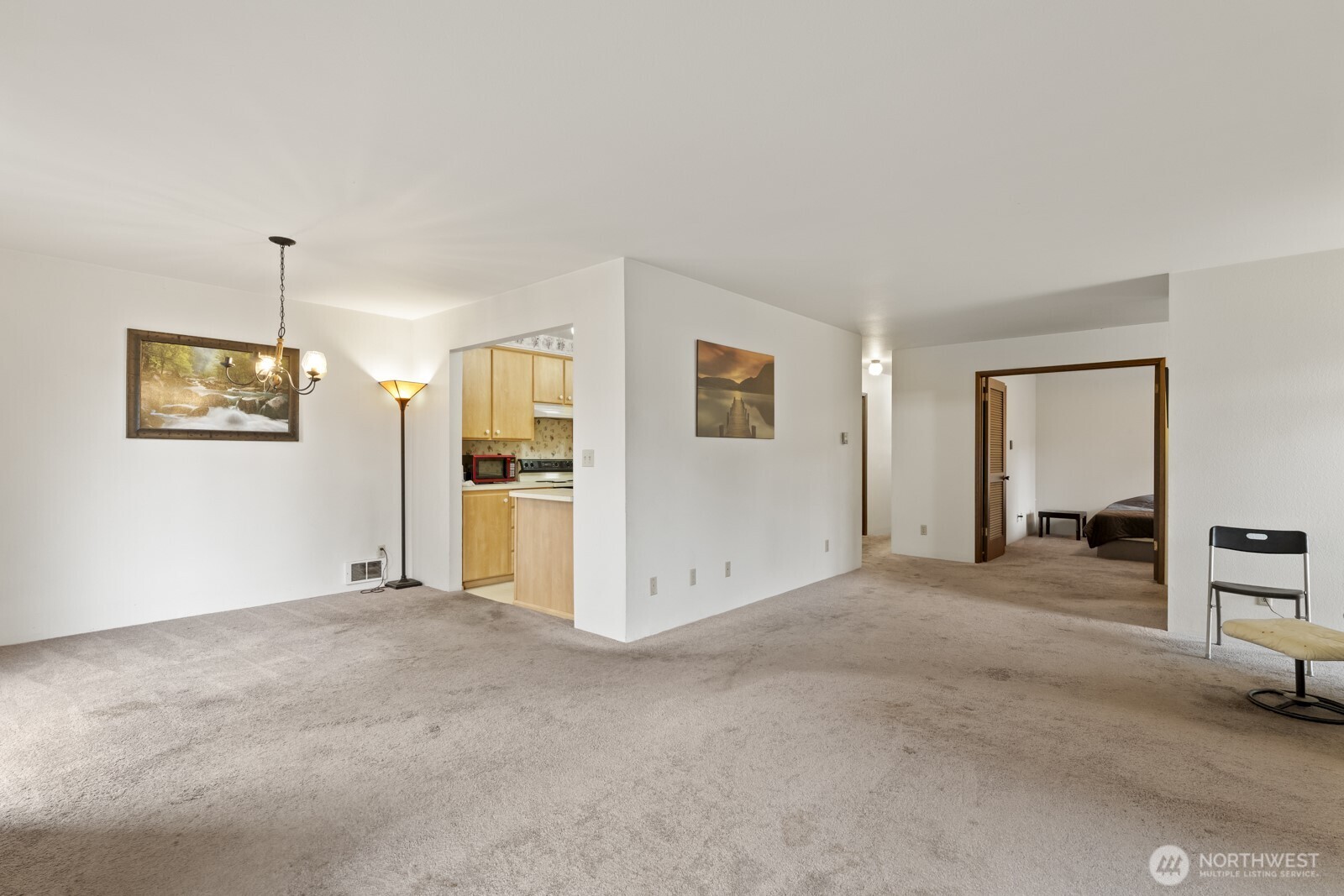 2510 Rucker Avenue, Unit 1 Everett, WA 98201 - Photo 21 of 34 a view of a livingroom with wooden floor and a kitchen