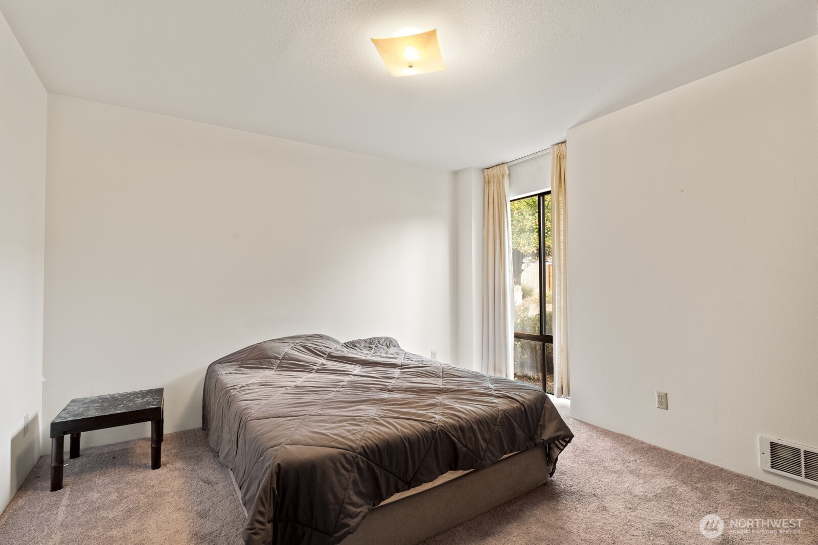 2510 Rucker Avenue, Unit 1 Everett, WA 98201 - Photo 27 of 34 a bedroom with a bed and a window