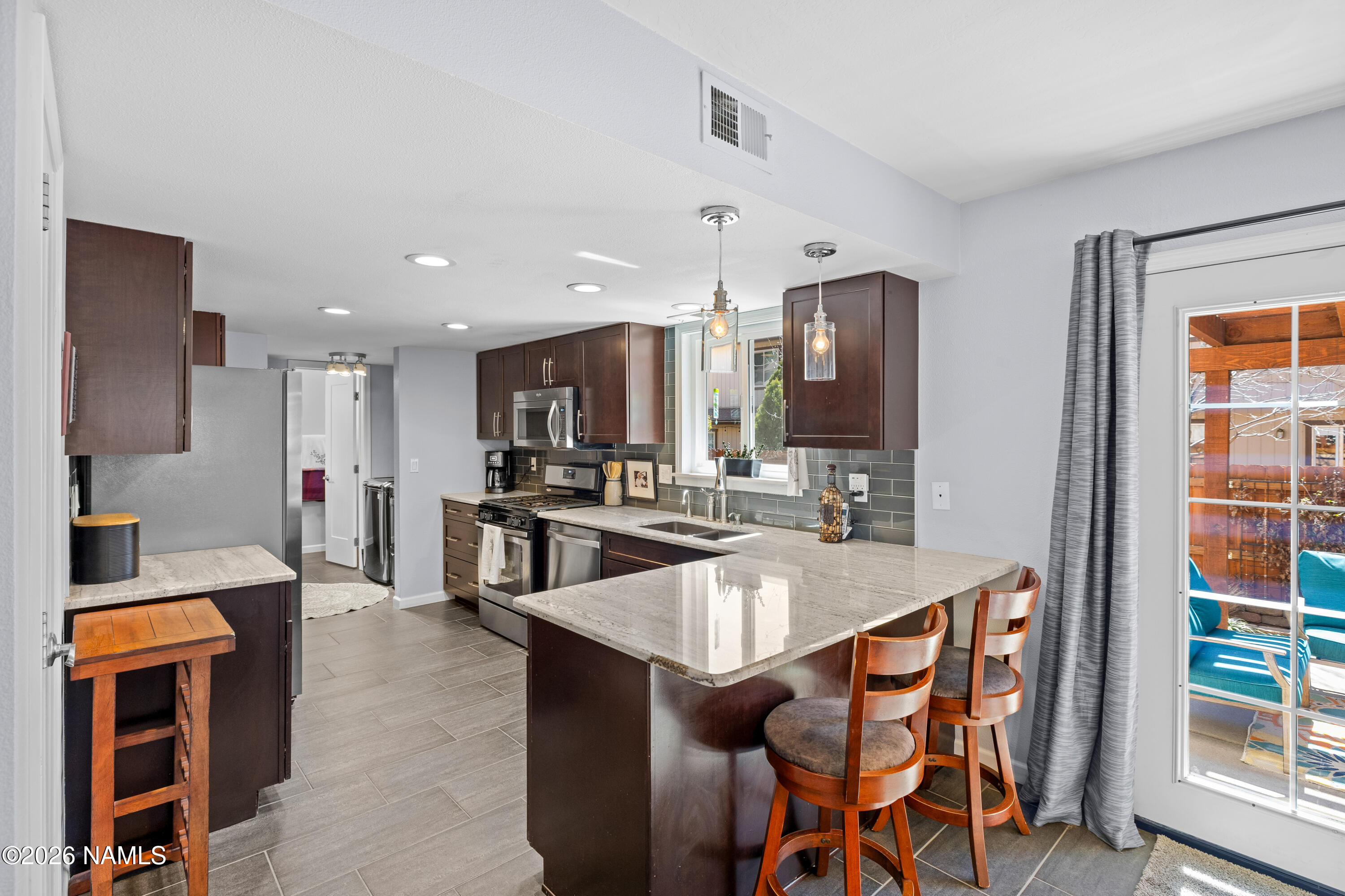2536 East Eva Loop Flagstaff, AZ 86004 - Photo 11 of 37 a large kitchen with a table and chairs