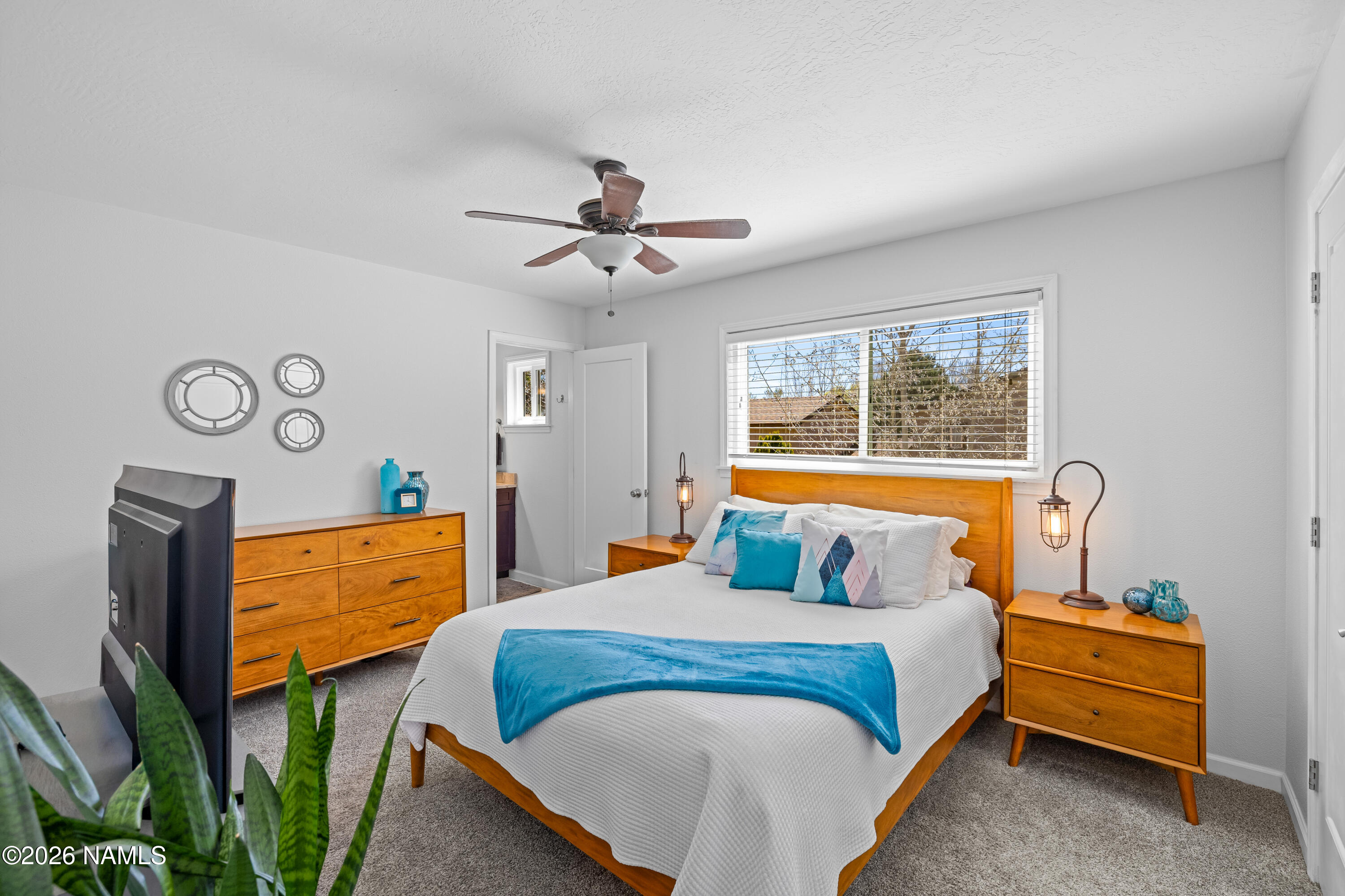 2536 East Eva Loop Flagstaff, AZ 86004 - Photo 17 of 37 a bedroom with bed and window