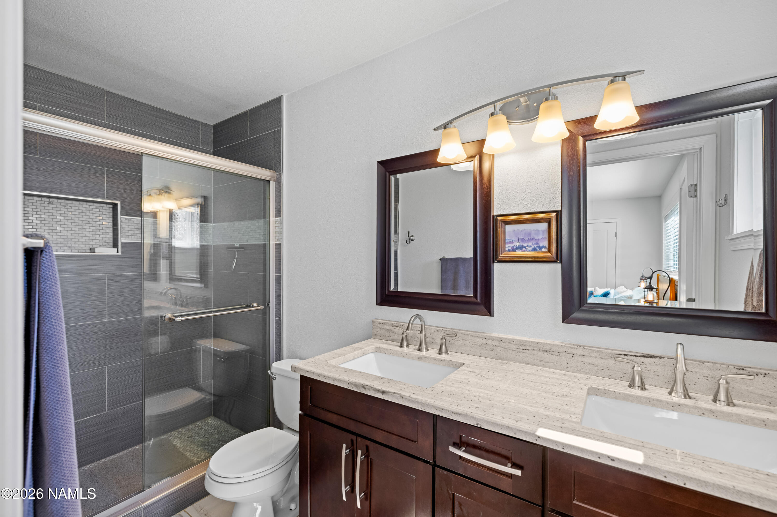 2536 East Eva Loop Flagstaff, AZ 86004 - Photo 20 of 37 a bathroom with a granite countertop sink toilet and shower
