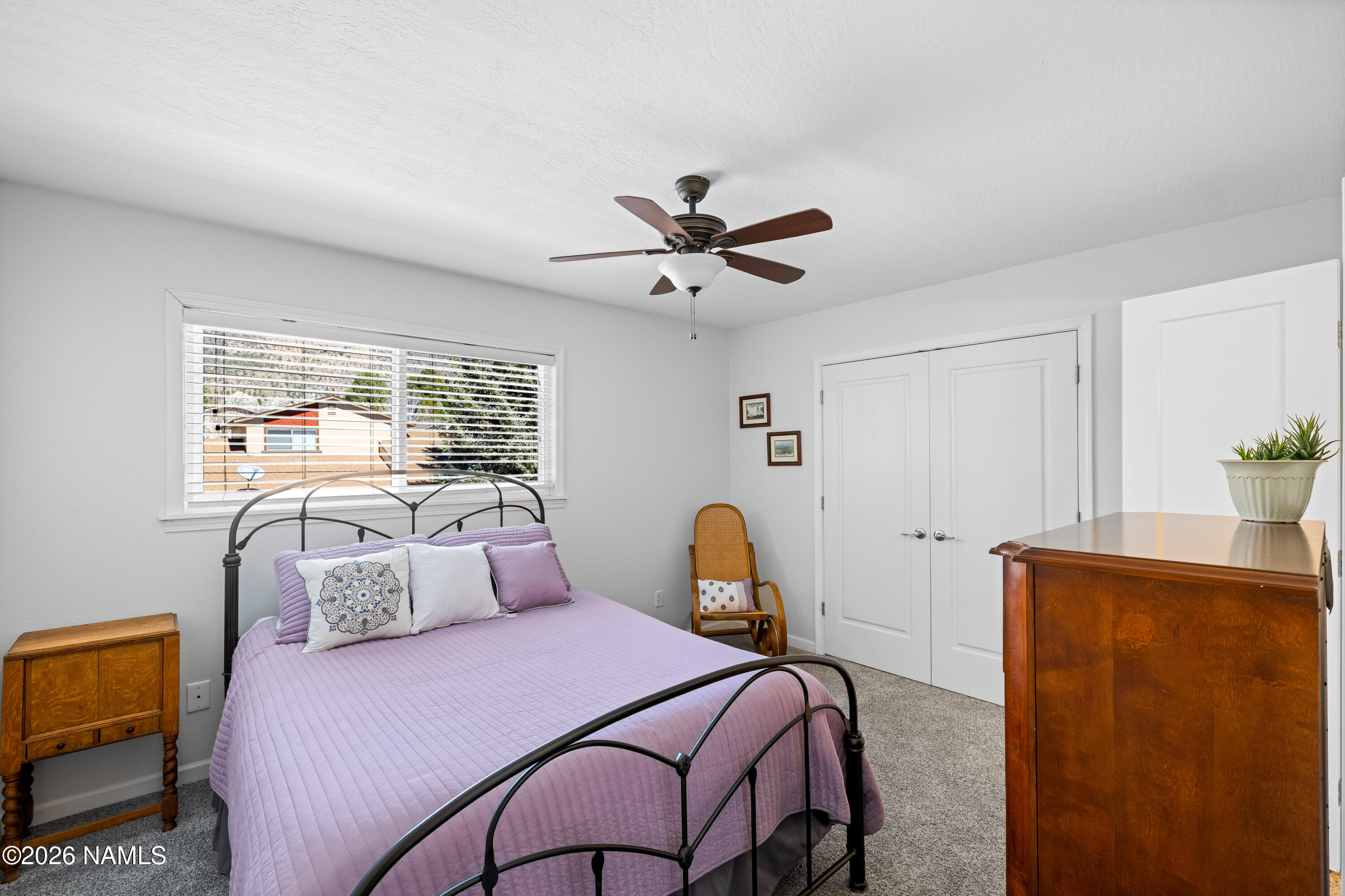 2536 East Eva Loop Flagstaff, AZ 86004 - Photo 22 of 37 a bedroom with a bed and wooden floor