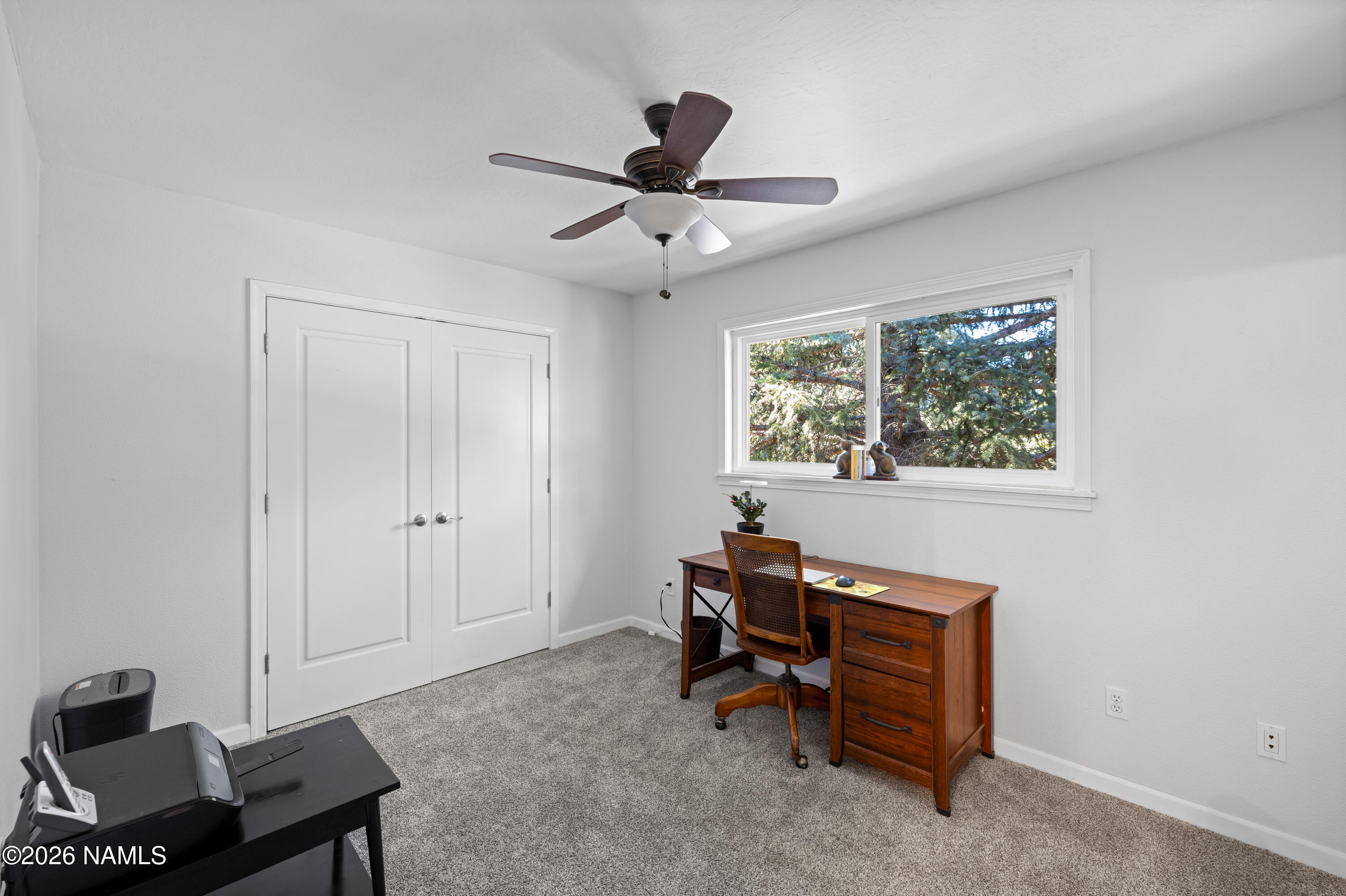 2536 East Eva Loop Flagstaff, AZ 86004 - Photo 26 of 37 a living room with furniture and a window