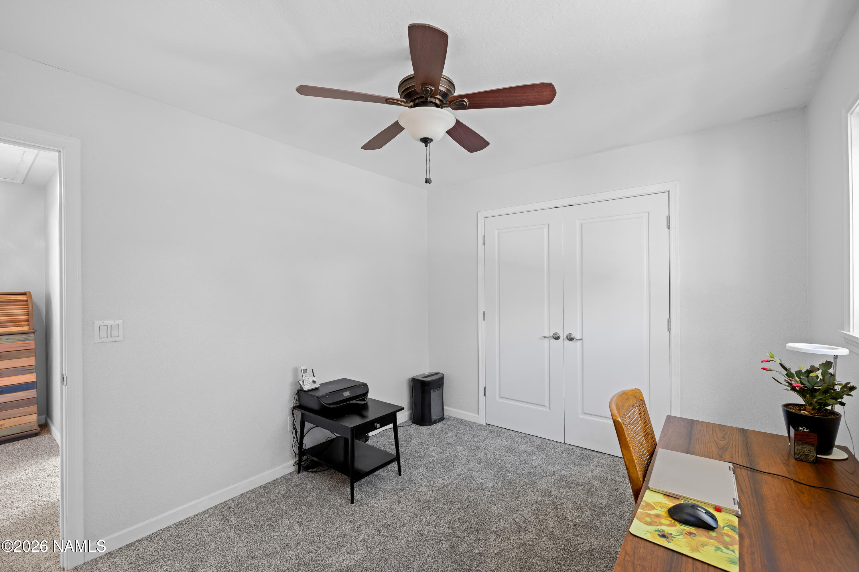 2536 East Eva Loop Flagstaff, AZ 86004 - Photo 27 of 37 a living room with furniture a rug and a window