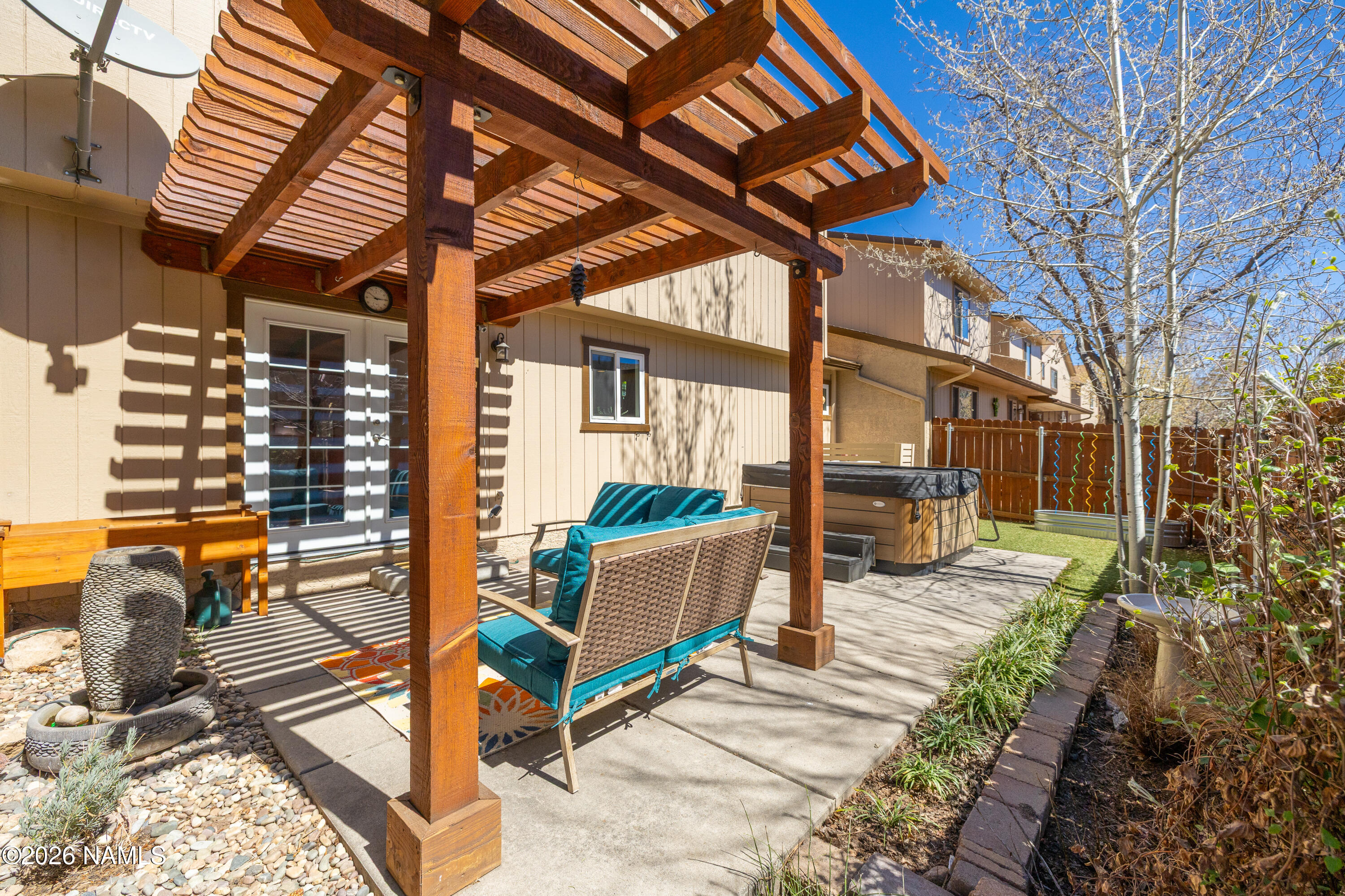 2536 East Eva Loop Flagstaff, AZ 86004 - Photo 30 of 37 a view of a porch with furniture and a yard