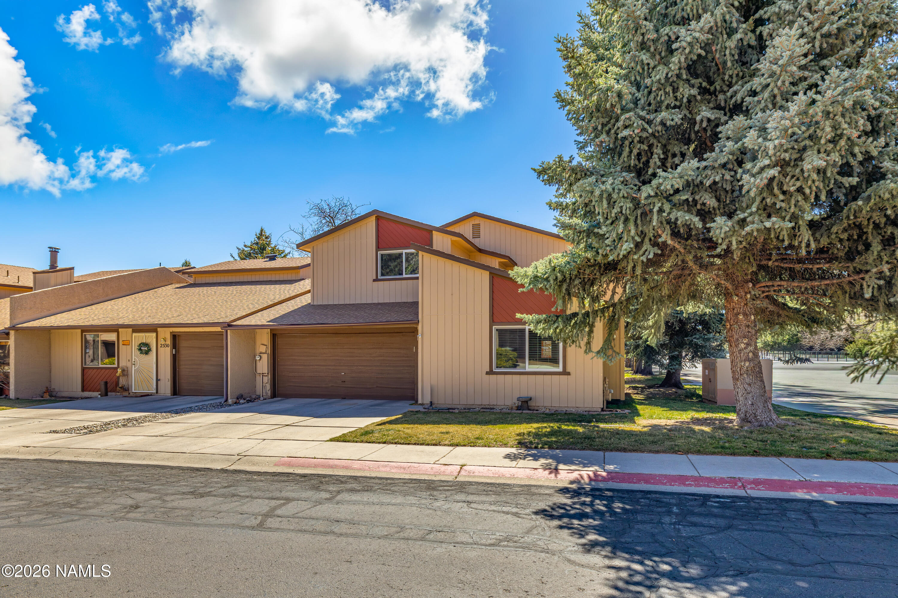 2536 East Eva Loop Flagstaff, AZ 86004 - Photo 3 of 37 a front view of a house with a garden