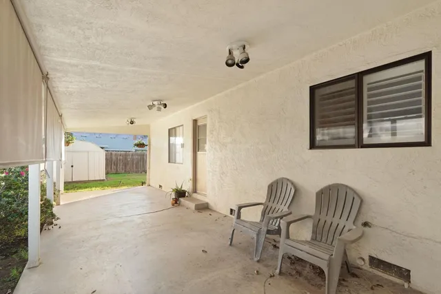 a view of a hallway with seating area