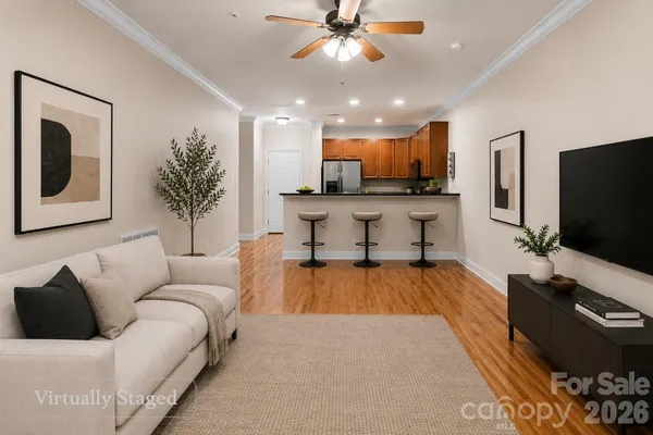 a living room with furniture and a flat screen tv