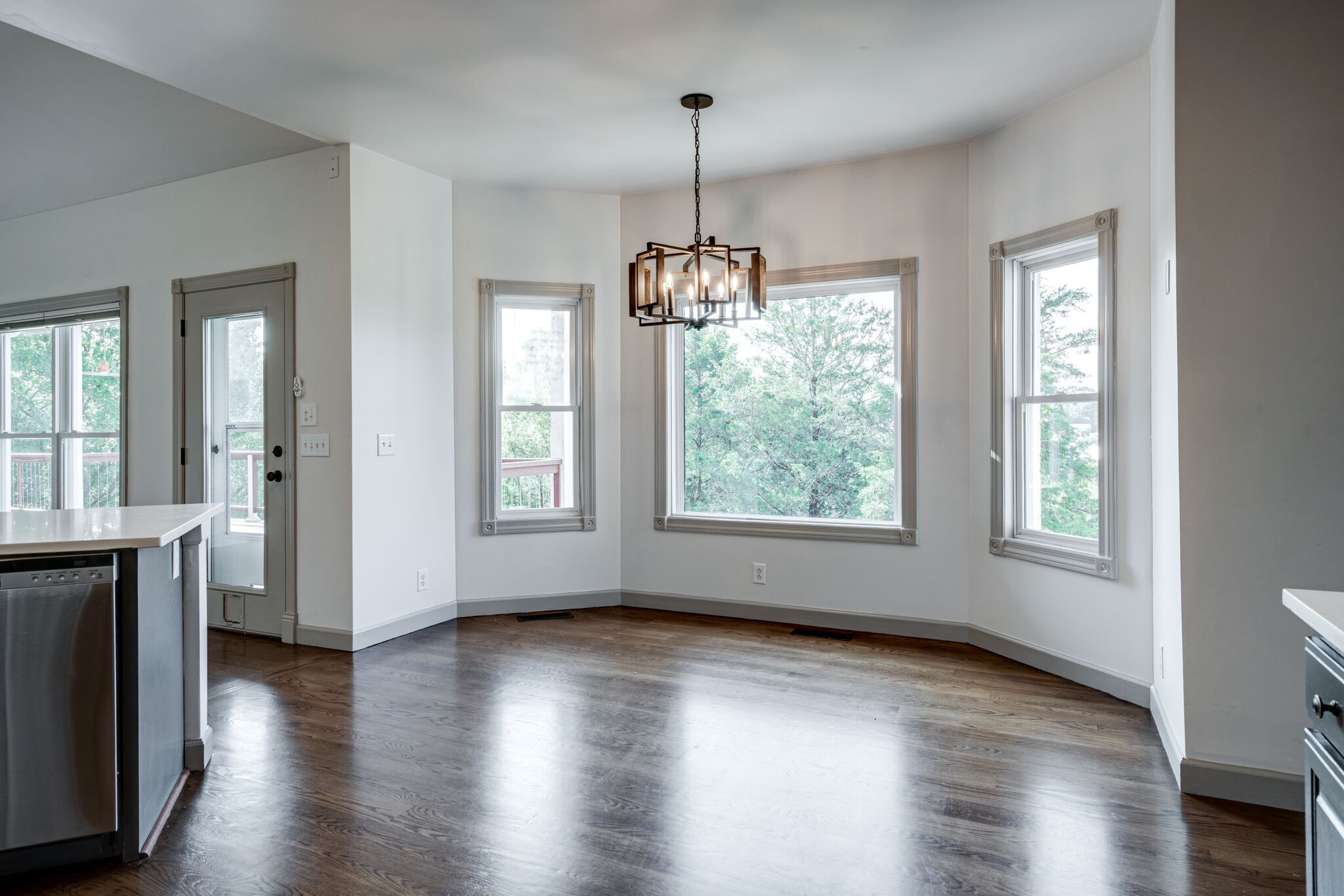 935 Barnes Road Antioch, TN 37013 - Photo 13 of 47 an empty room with wooden floor and windows
