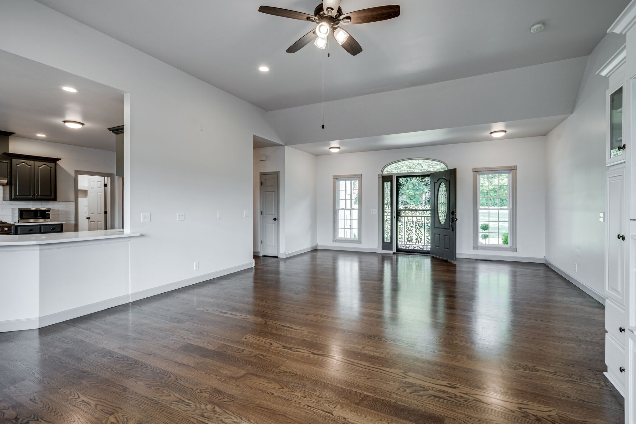 935 Barnes Road Antioch, TN 37013 - Photo 4 of 47 a view of an empty room with wooden floor and a window