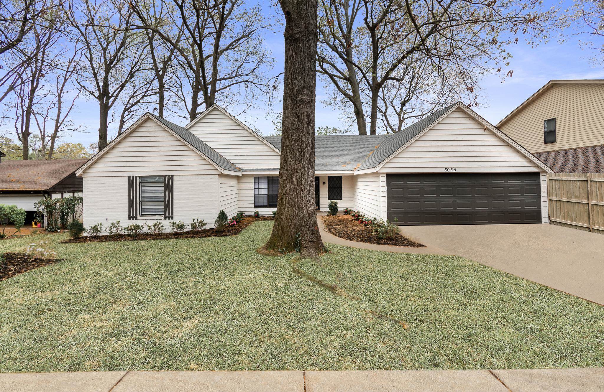 front view of a house with yard