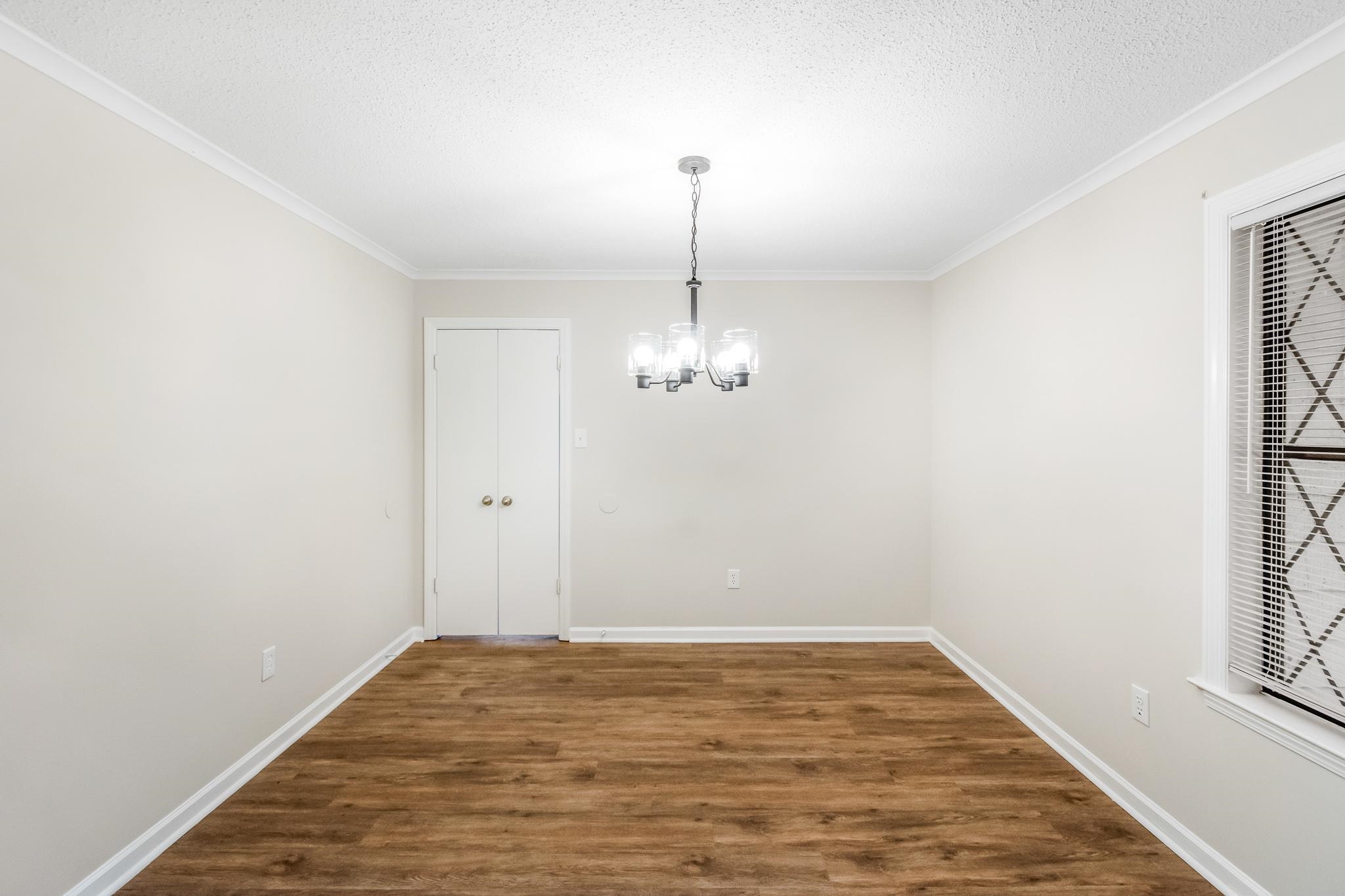 3036 Canyon Road Memphis, TN 38134 - Photo 12 of 24 a view of a room with wooden floor and ceiling fan