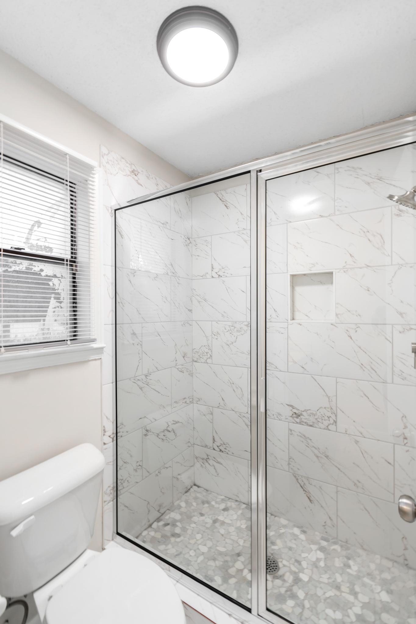 3036 Canyon Road Memphis, TN 38134 - Photo 15 of 24 a bathroom with a shower and a toilet