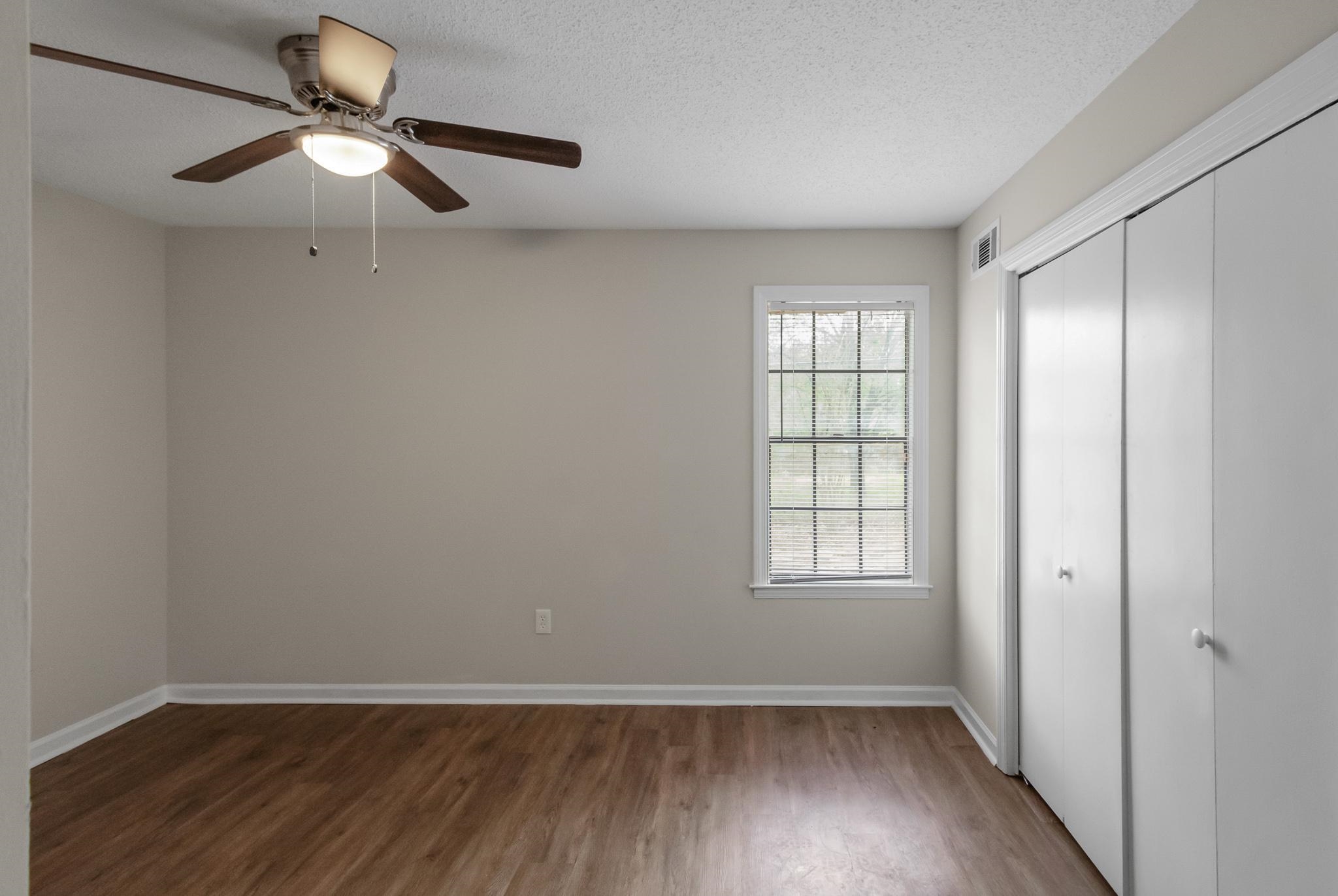 3036 Canyon Road Memphis, TN 38134 - Photo 22 of 24 wooden floor in an empty room with a window