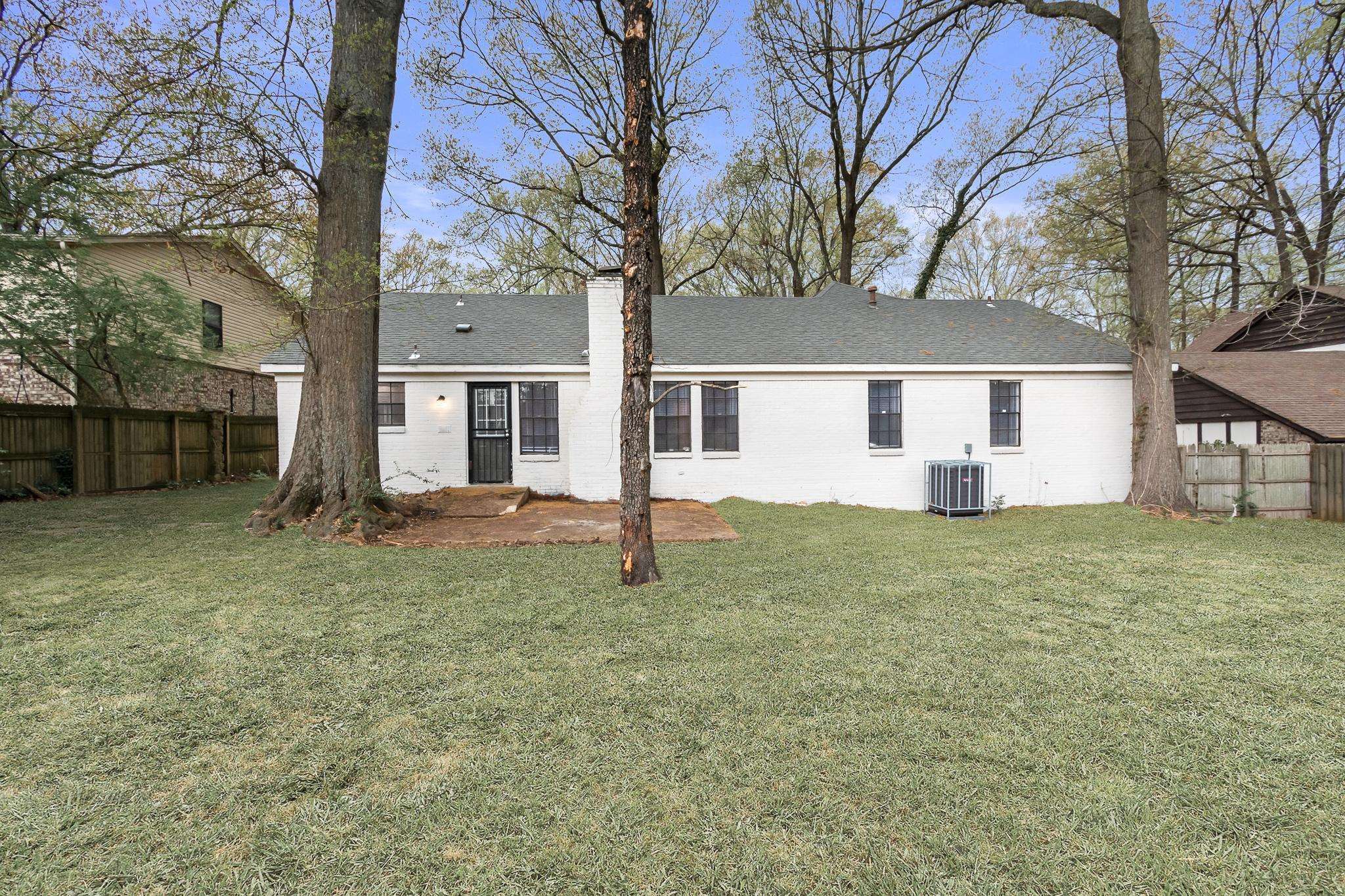 3036 Canyon Road Memphis, TN 38134 - Photo 4 of 24 front view of a house with a yard
