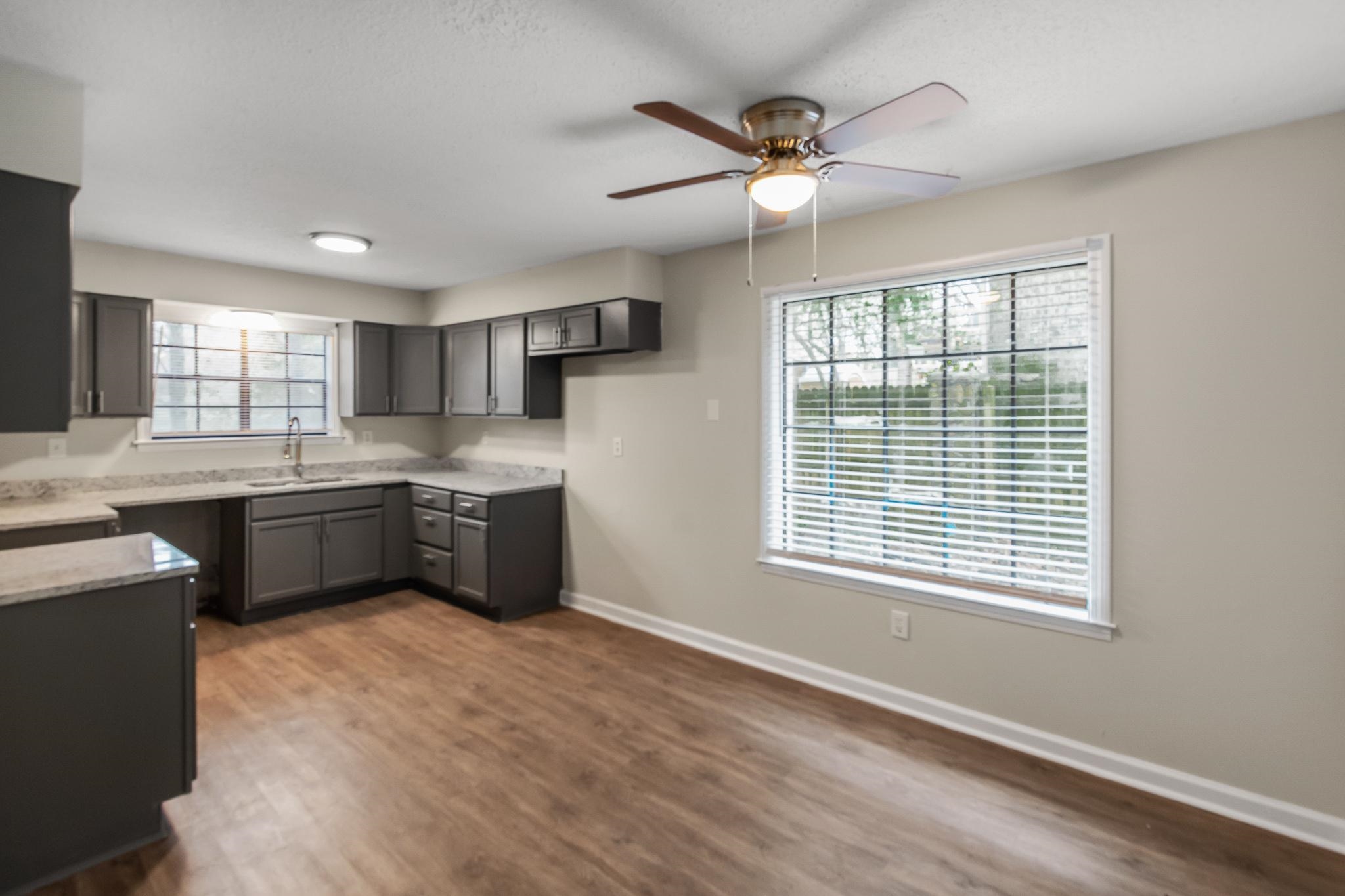 3036 Canyon Road Memphis, TN 38134 - Photo 10 of 24 a kitchen with a stove a sink and a window