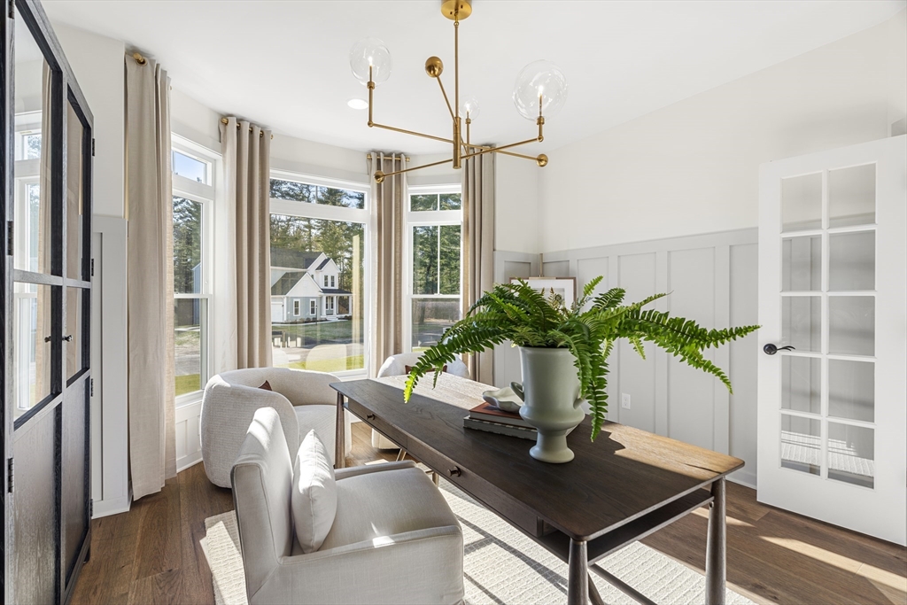 29 Germain Way, Unit 3 Norton, MA 02766 - Photo 20 of 40 a view of a workspace with furniture and a potted plant