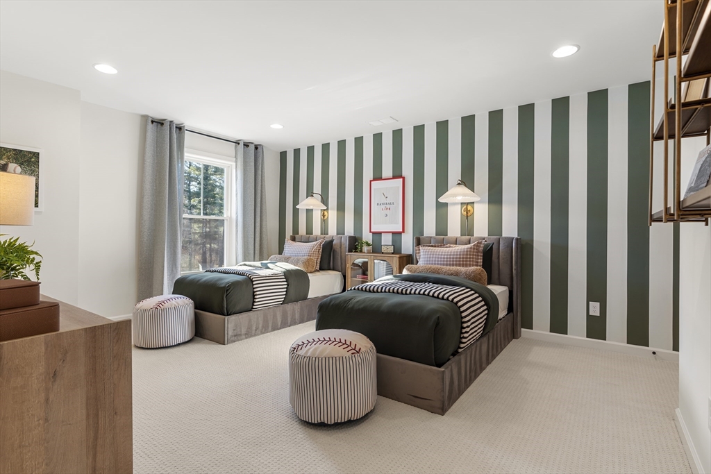 29 Germain Way, Unit 3 Norton, MA 02766 - Photo 25 of 40 a spacious bedroom with a bed and a couch