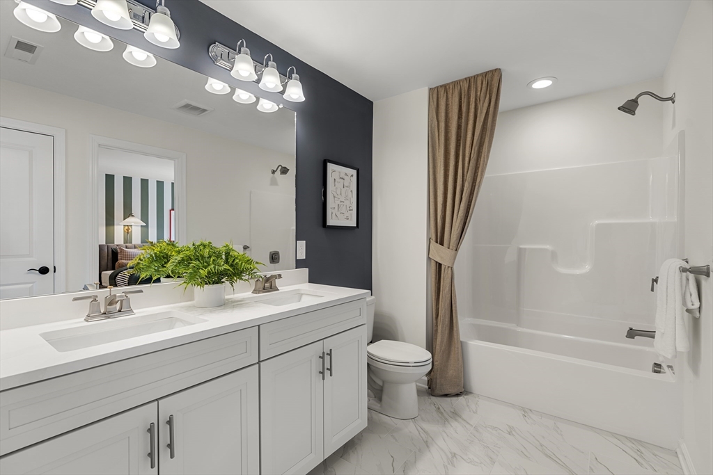 29 Germain Way, Unit 3 Norton, MA 02766 - Photo 26 of 40 a bathroom with a sink a toilet and shower