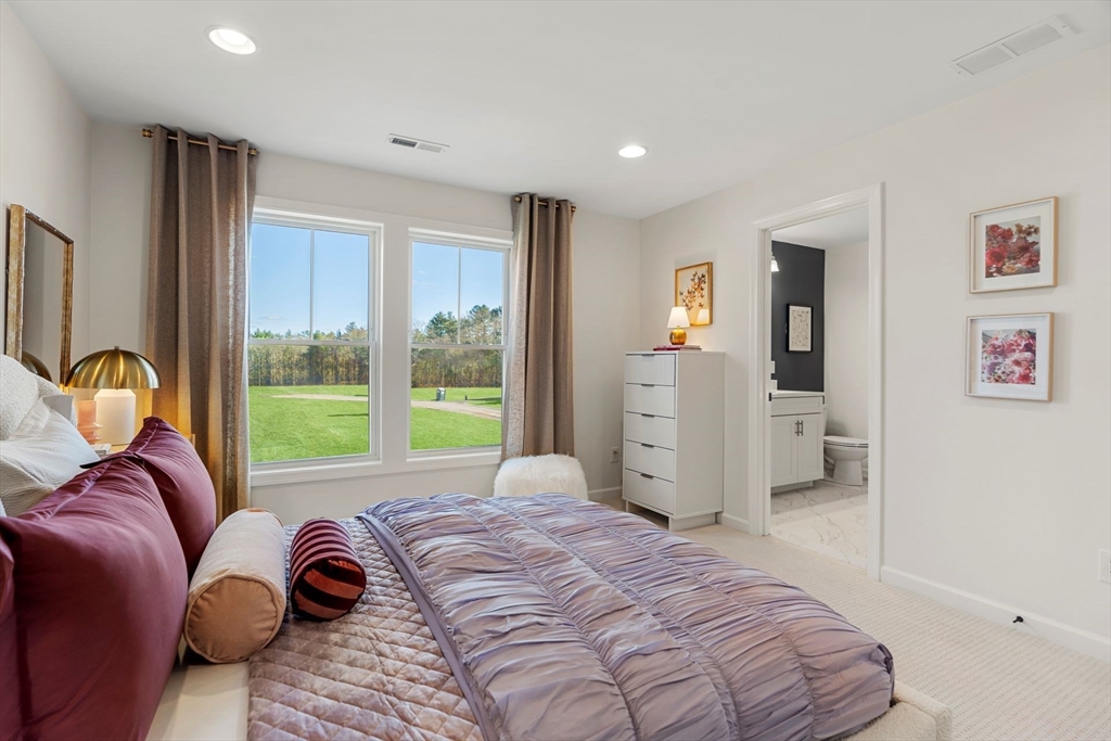 29 Germain Way, Unit 3 Norton, MA 02766 - Photo 27 of 40 a bedroom with a bed and a large window